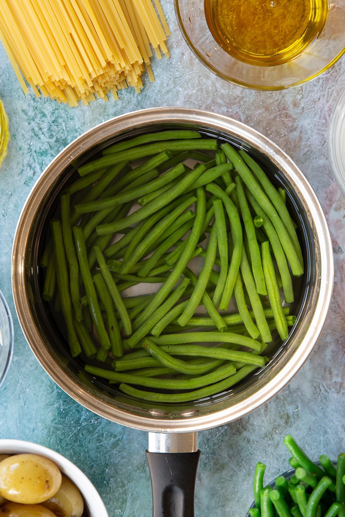 Overhead shot of green beans in a pan.