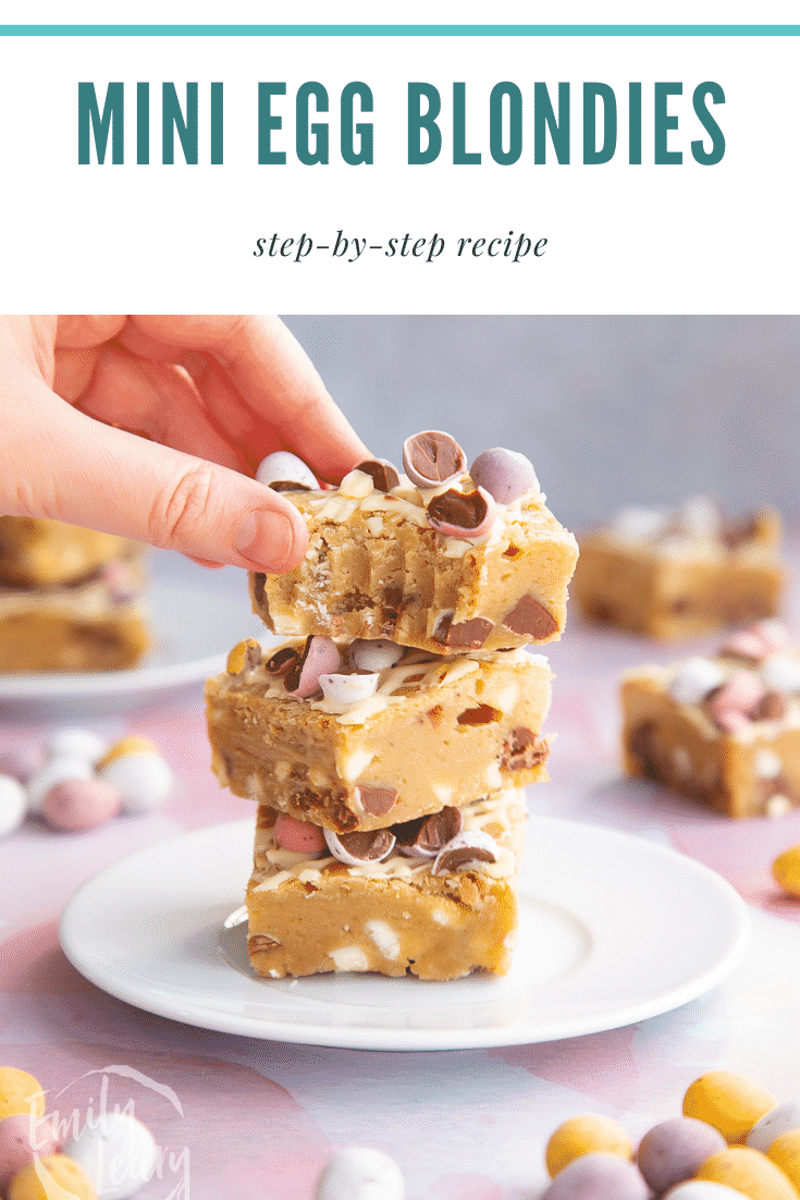 Stack on Mini Egg blondies on a white plate. A hand reaches for a bitten one. Caption reads: Mini Egg blondies step-by-step recipe