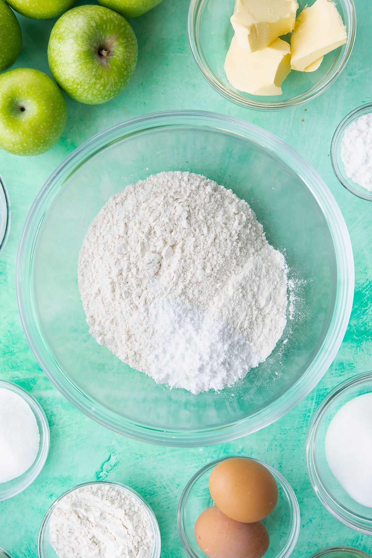 Overhead shot of flour and icing sugar in a bowl.