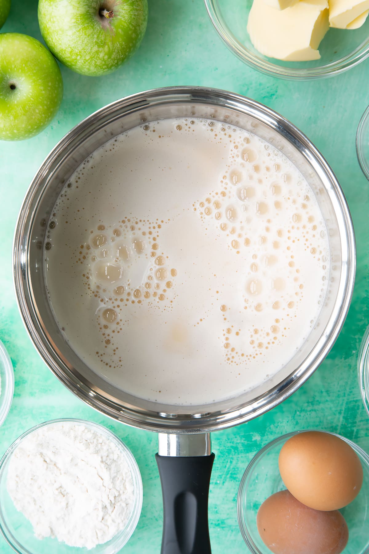 Adding the custard ingredients to the pan.