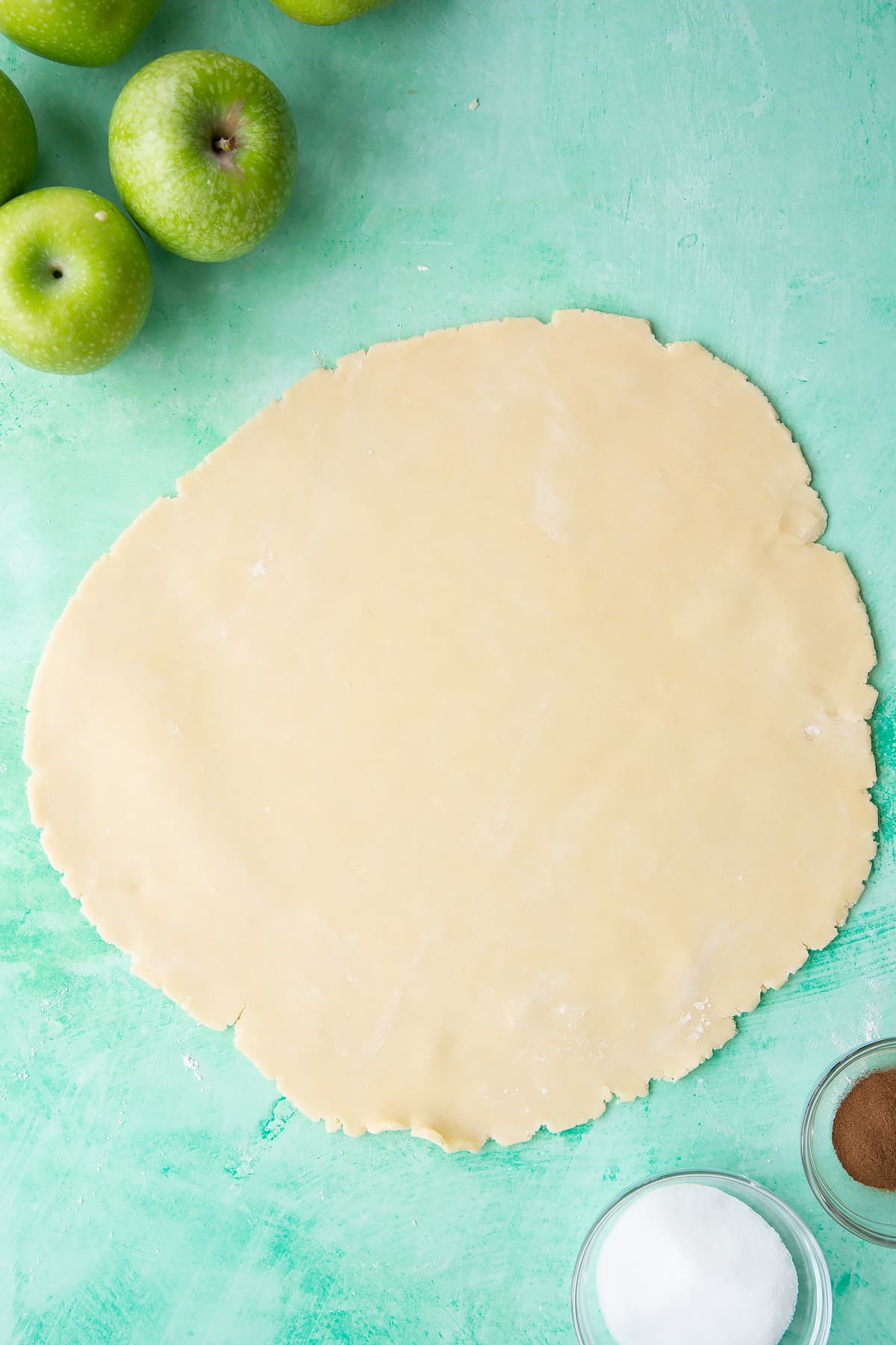 Overhead shot of the pastry rolled out on a lightly floured surface.