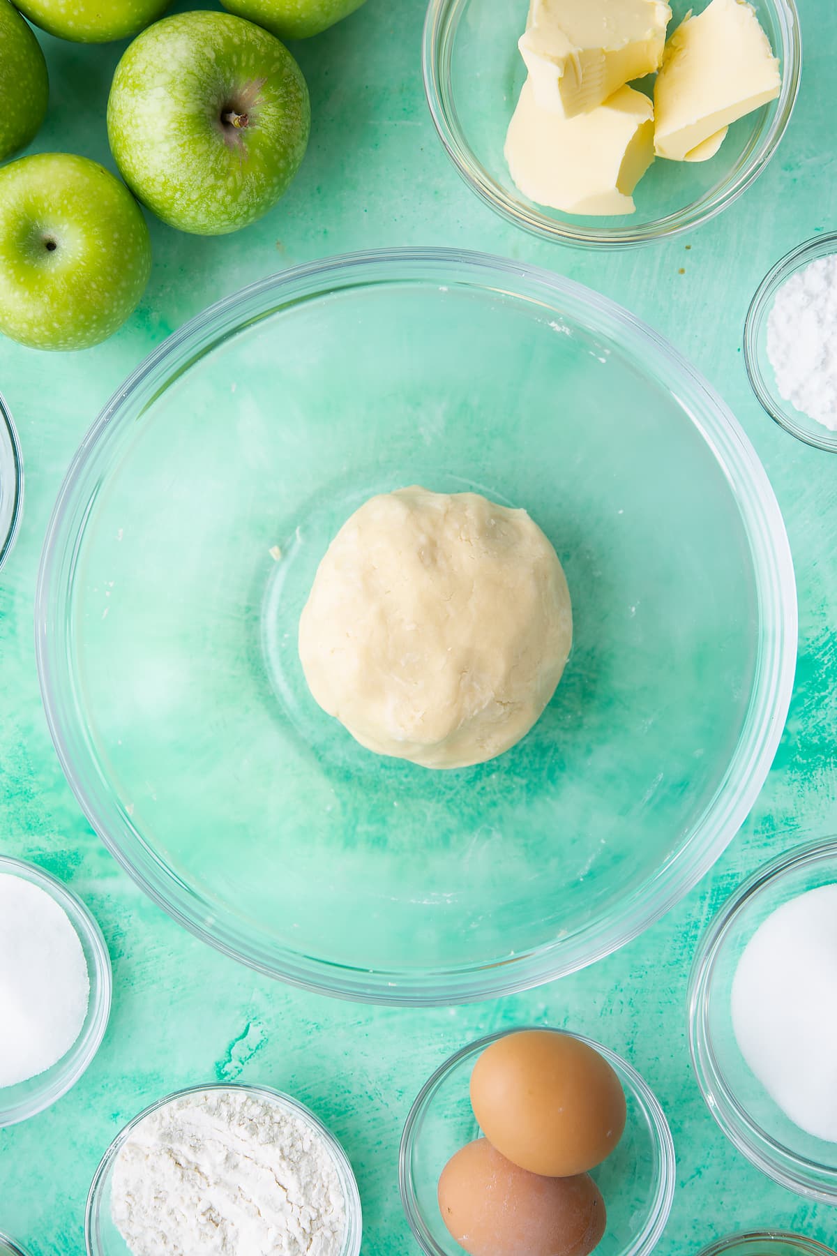 Overhead shot of a dough ball in a mixing bowl.