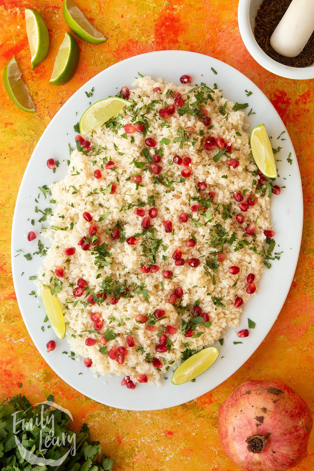 Finished plate of cauliflower couscous with pomegranate.