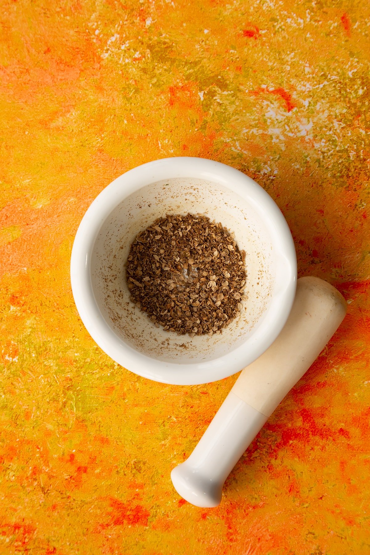 Crushed cumin and coriander seeds.