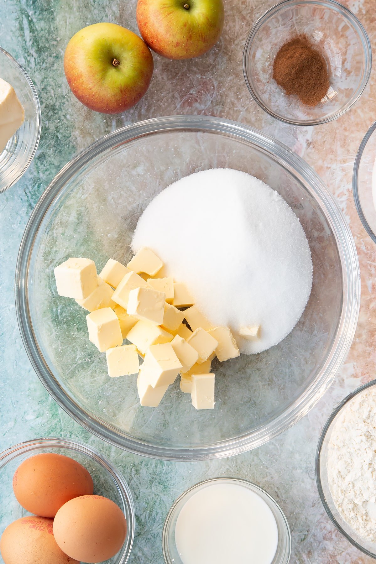 Sugar and butter in a large mixing bowl.