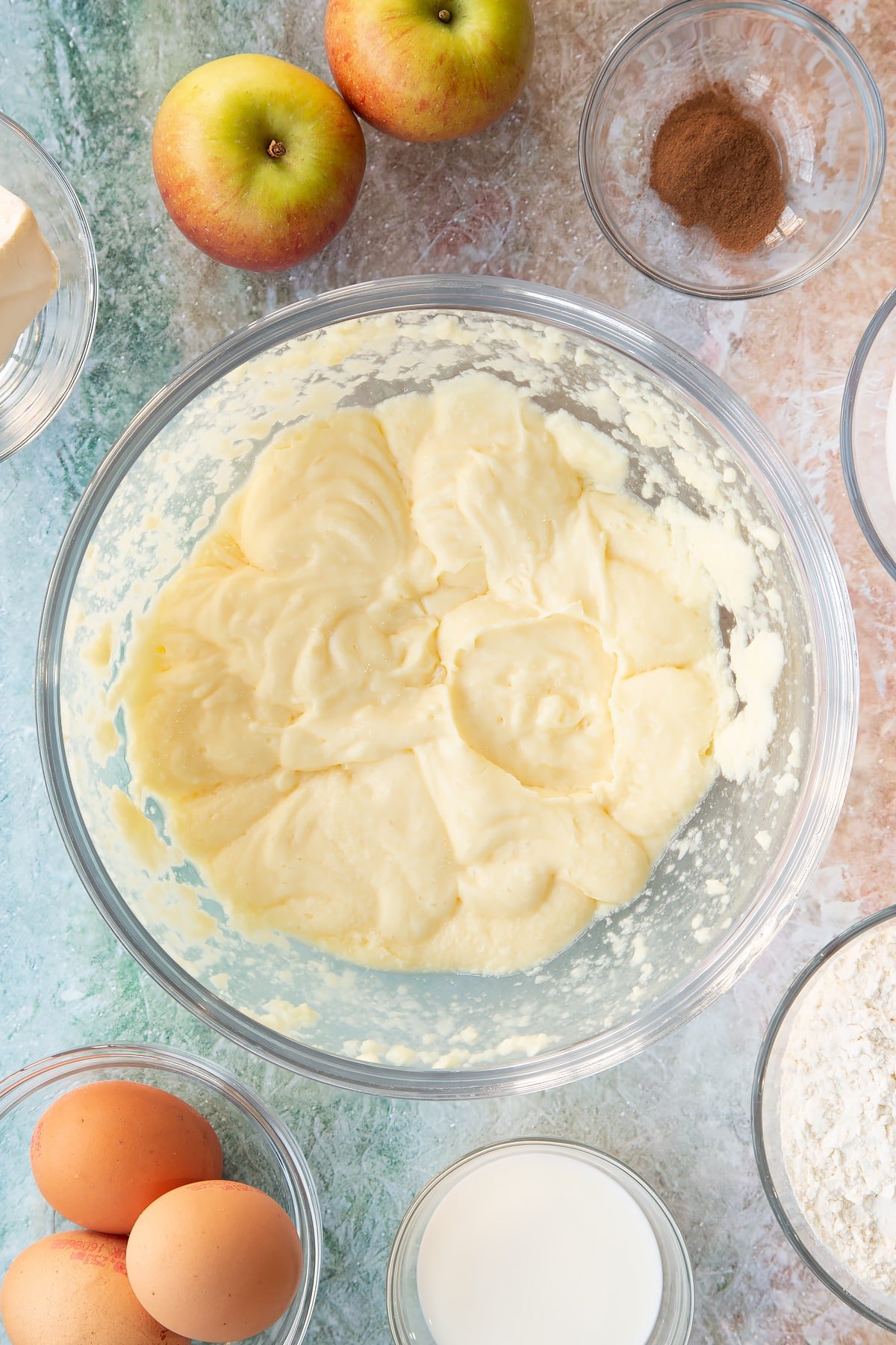 Cake batter ingredients having been whisked together in a mixing bowl. 