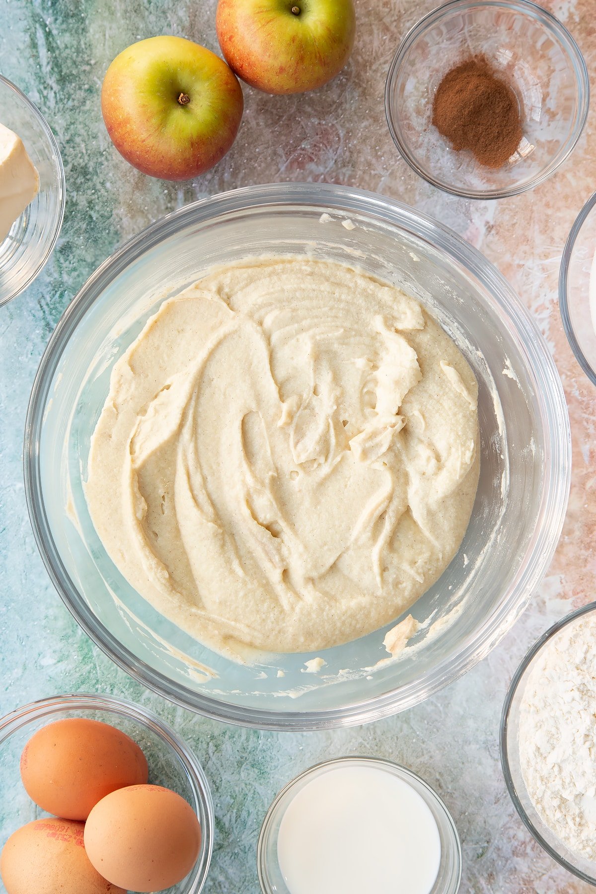 Cake ingredients having been whisked together in a mixing bowl.