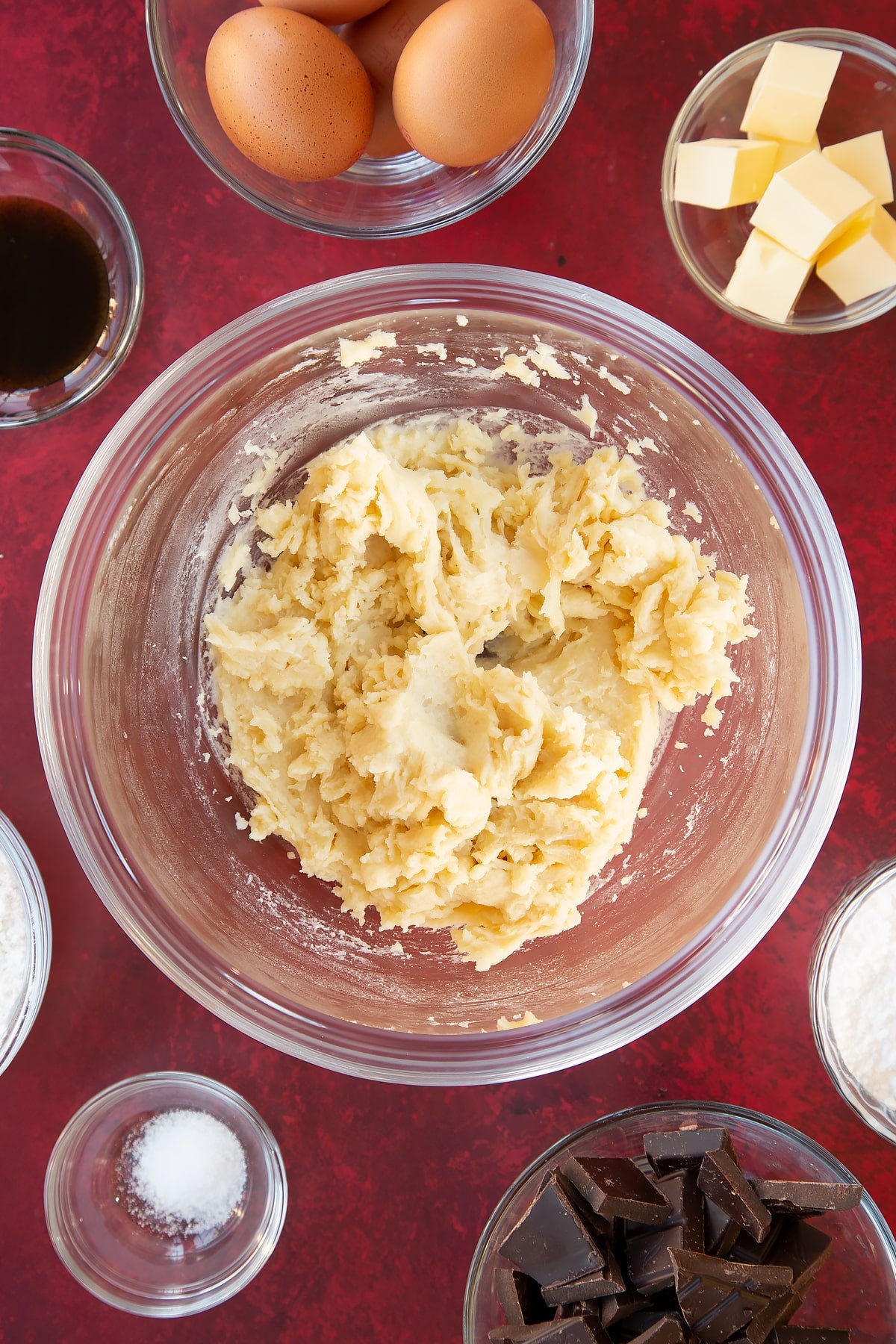 Mini eclairs pastry having slowly added the eggs into the bowl.