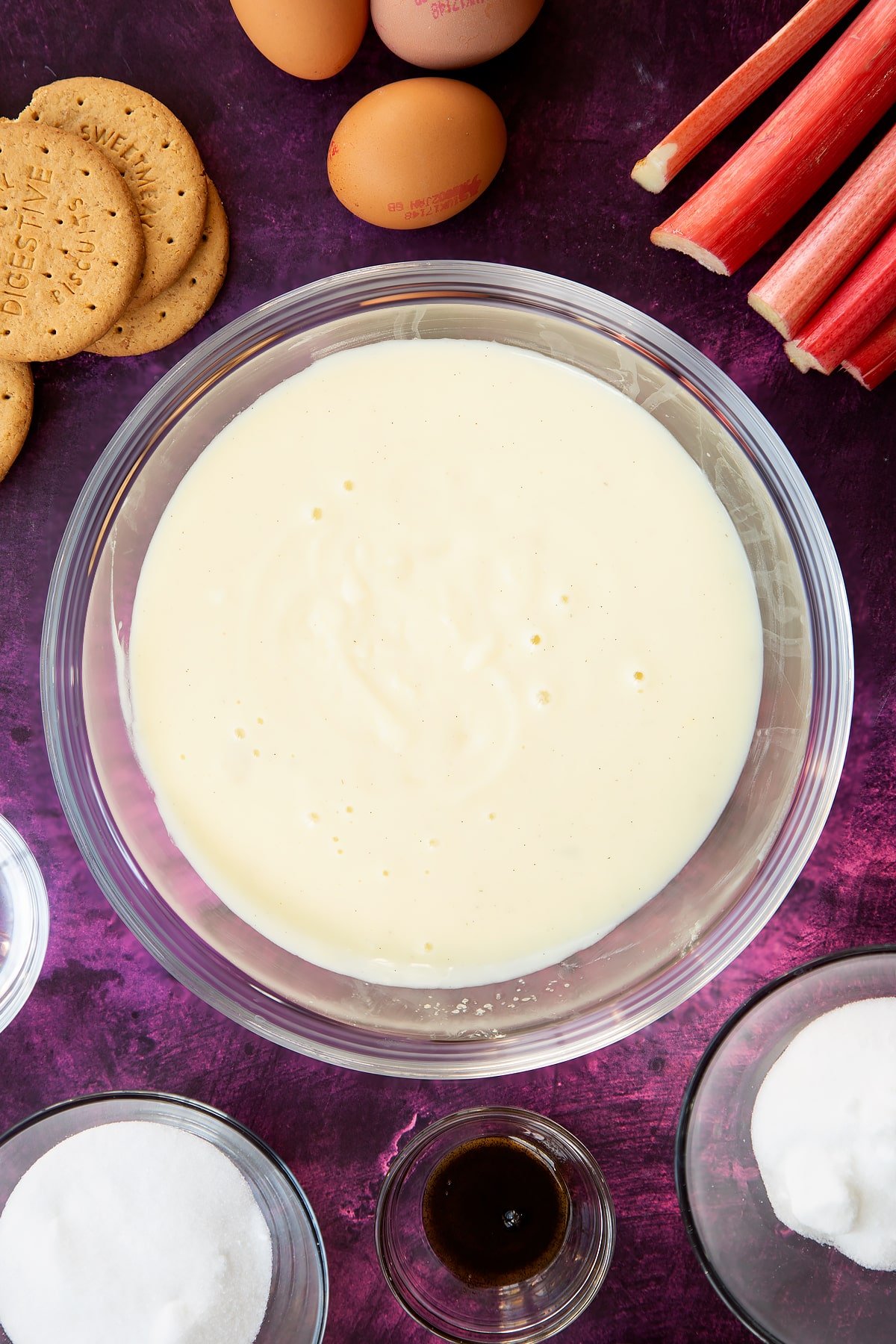 custard mix setting to look more solid and yellow in a large clear bowl.