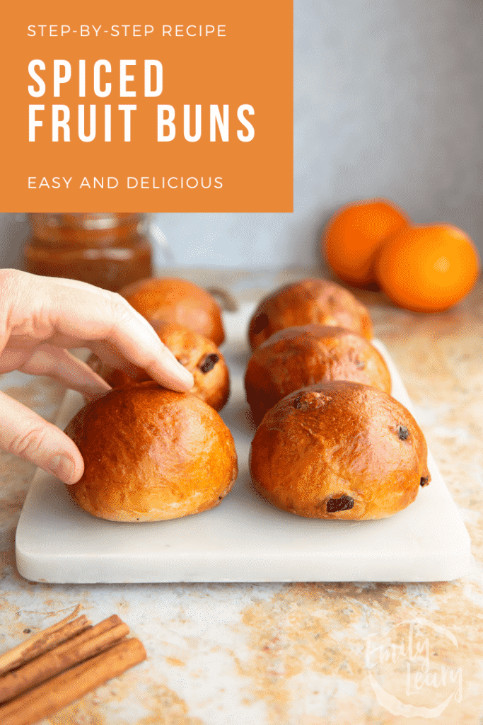 Pinterest image for the spiced fruit buns with text at the top describing the image for Pinterest.