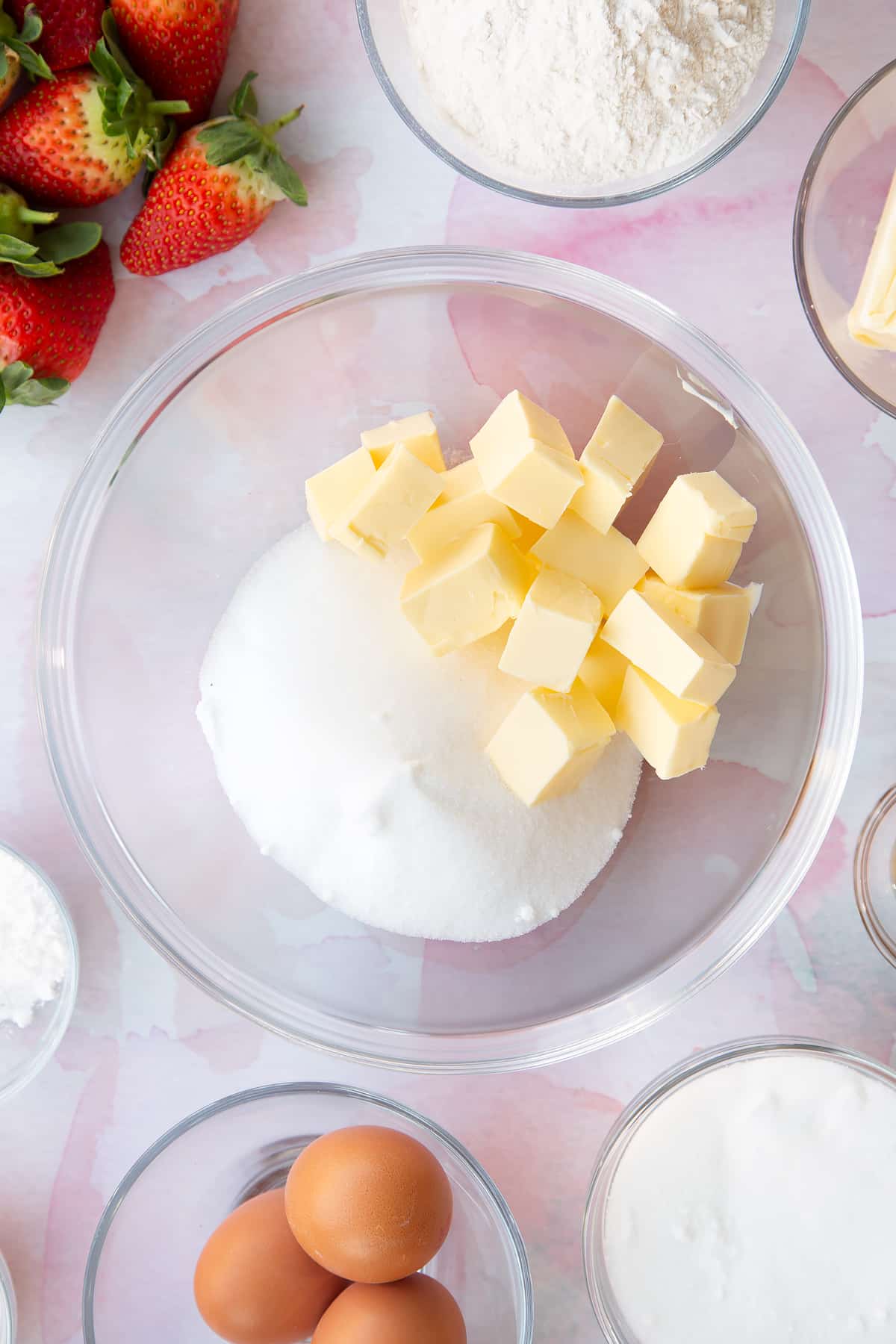 cubed butter and sugar in a large clear bowl