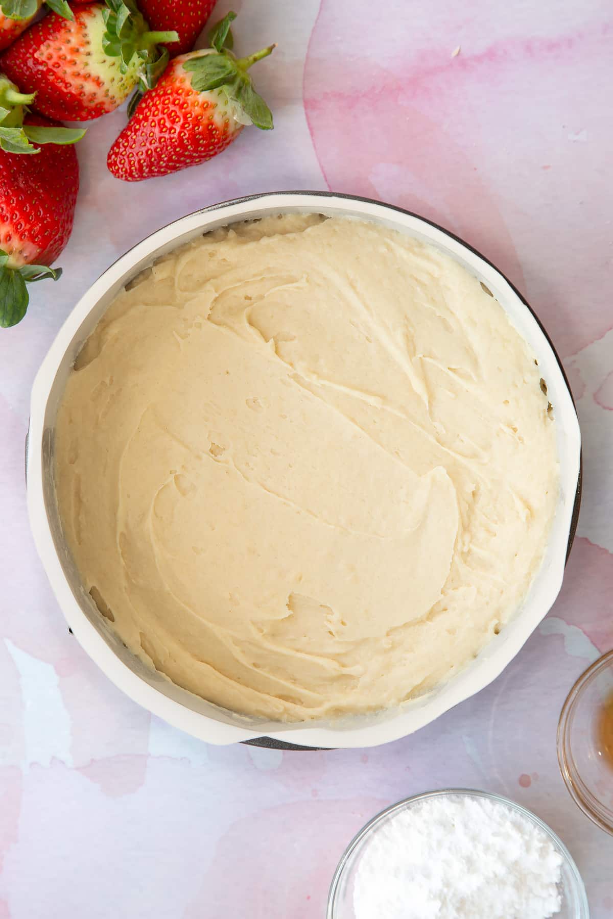 creamed mixture in a parchement lined cake tin smoothed out to fill the tin.