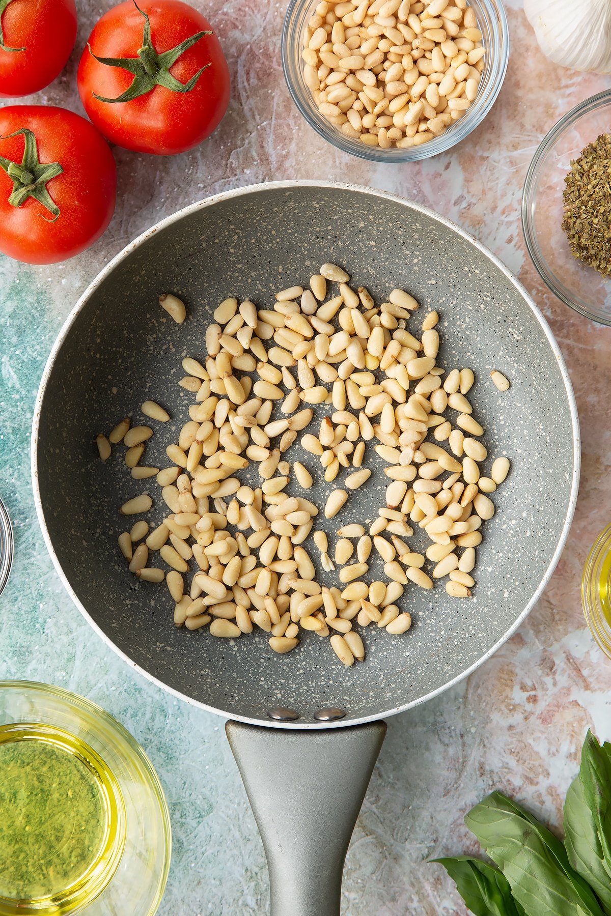 Pine nuts in a pan.