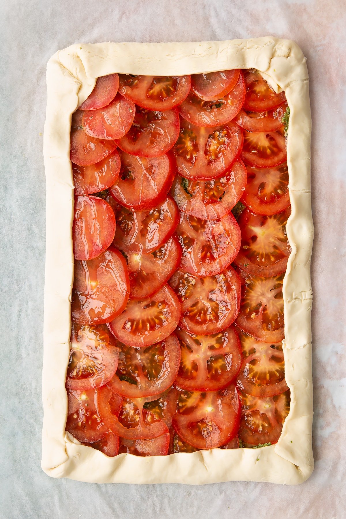 Drizzle the top of the puff pastry with oil.