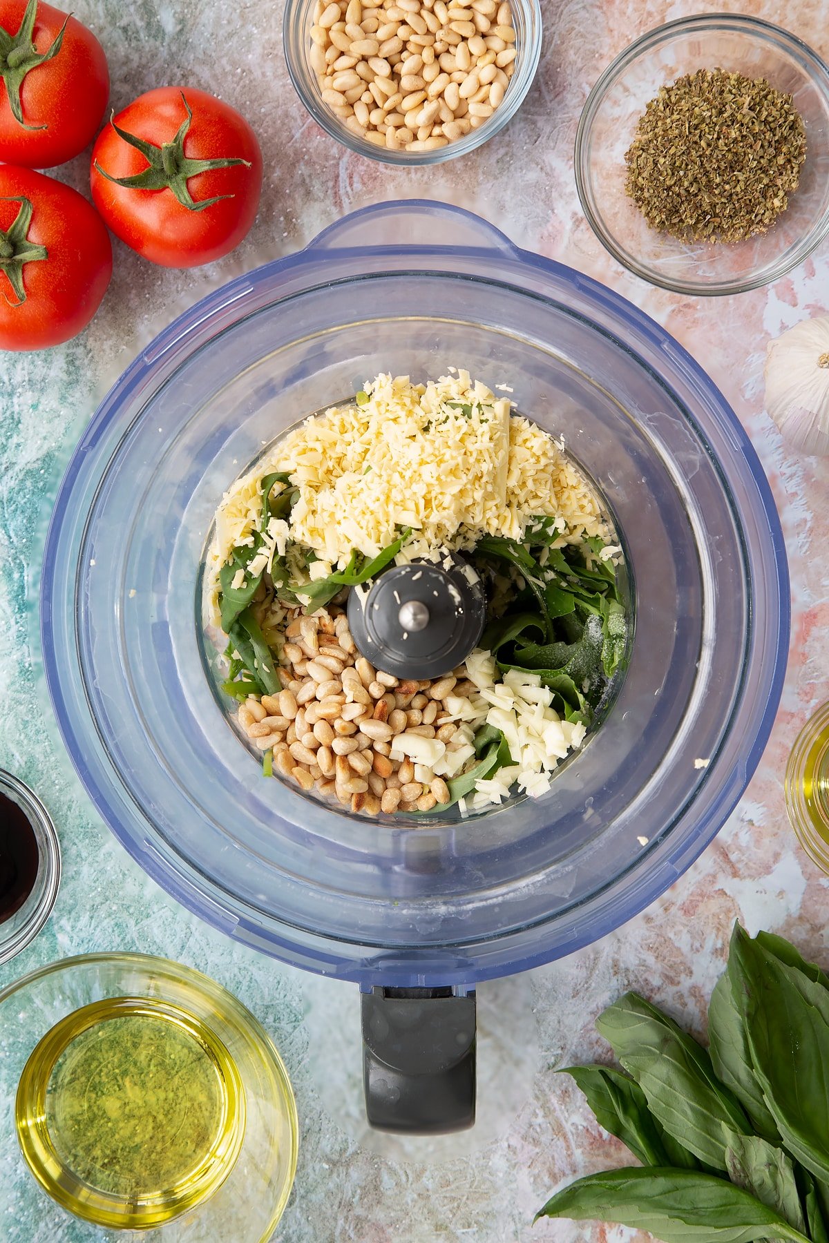 Adding the pesto ingredients to the blender.