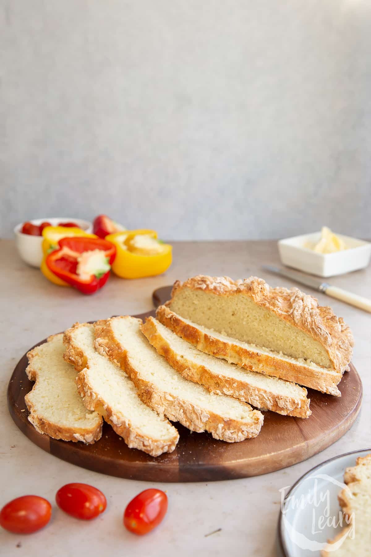 Sliced white spelt soda bread on a wooden board.