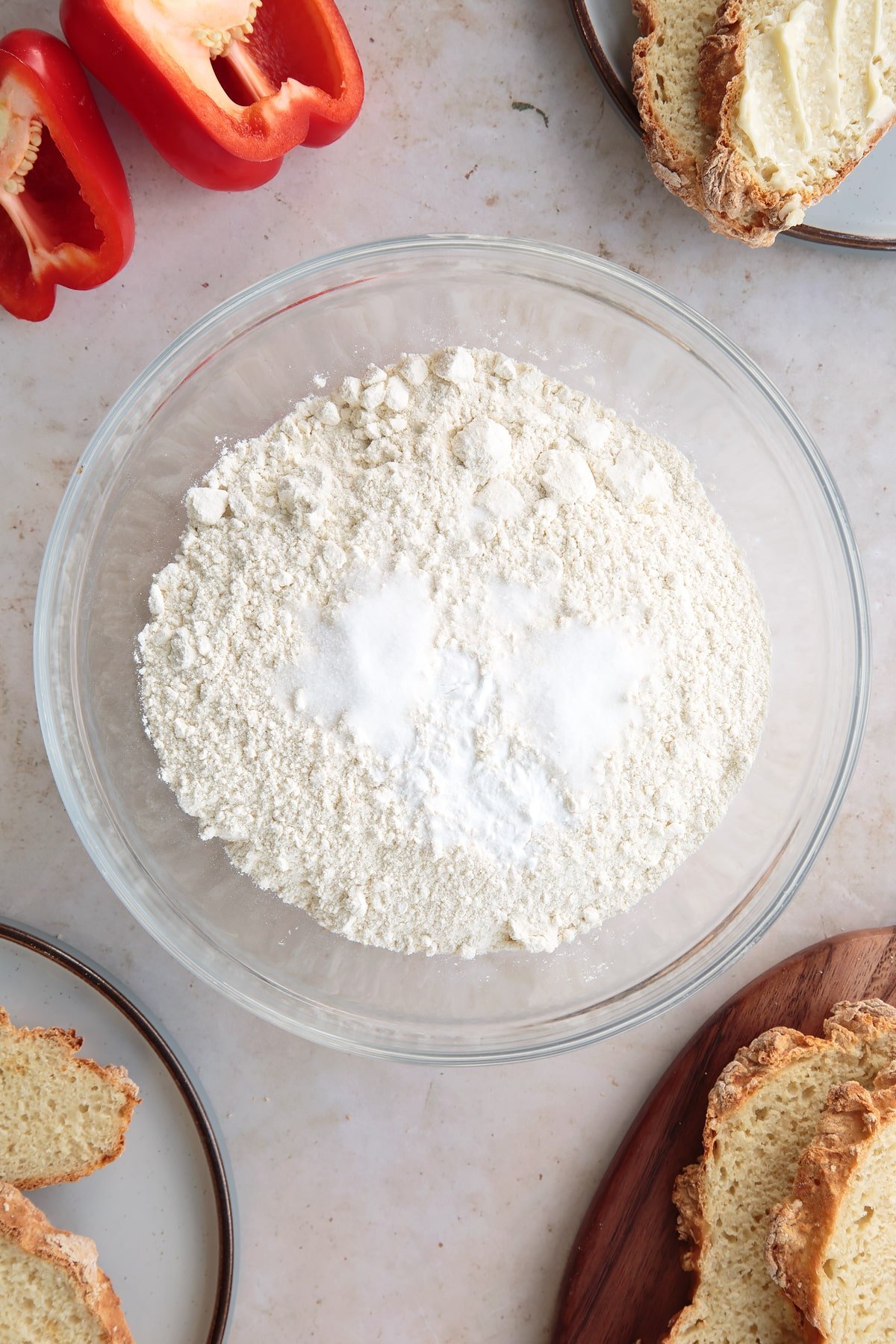 Overhead shot of spelt flour, salt and bicarbonate of soda in a bowl.