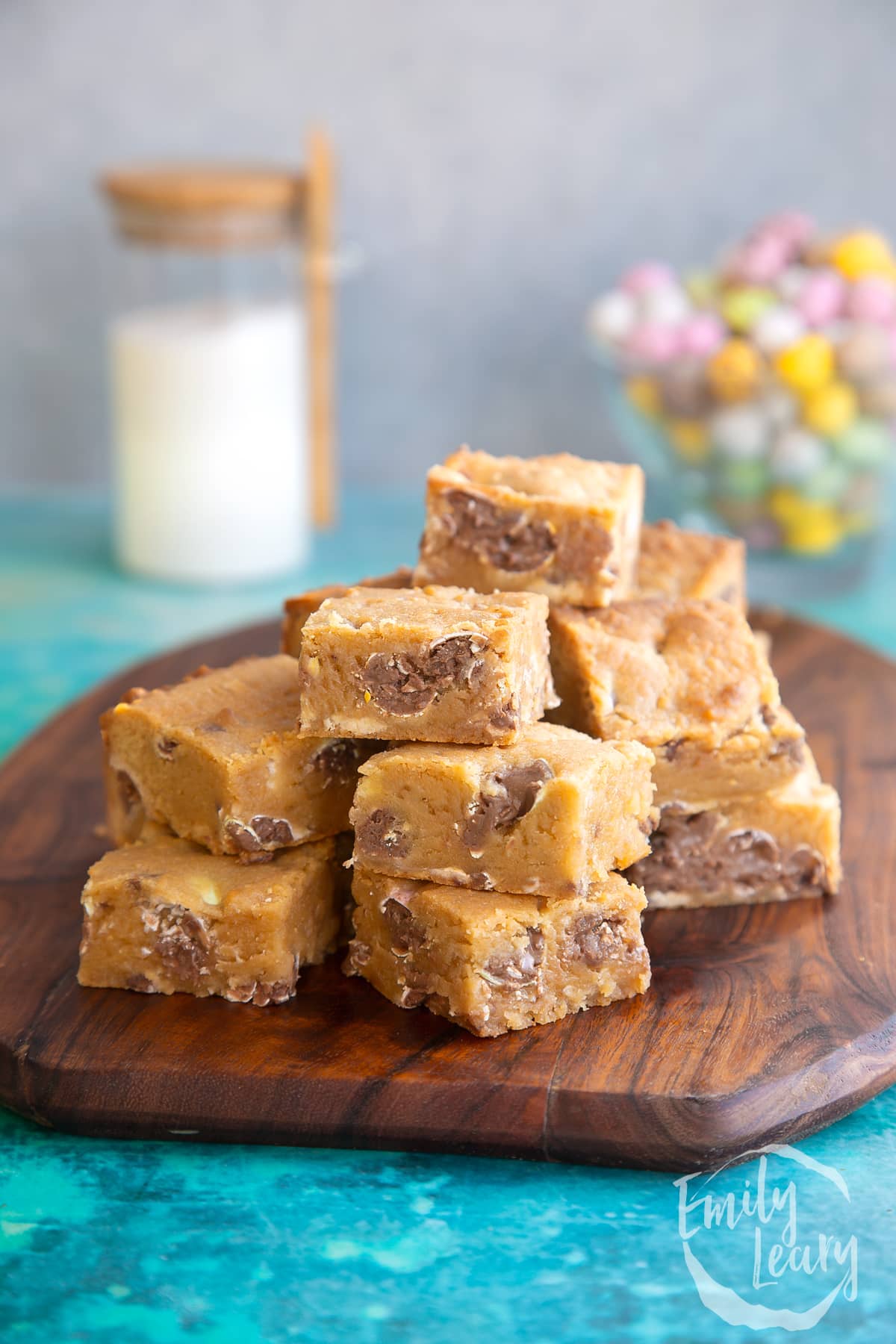 Easter cookie bars on a wooden board.