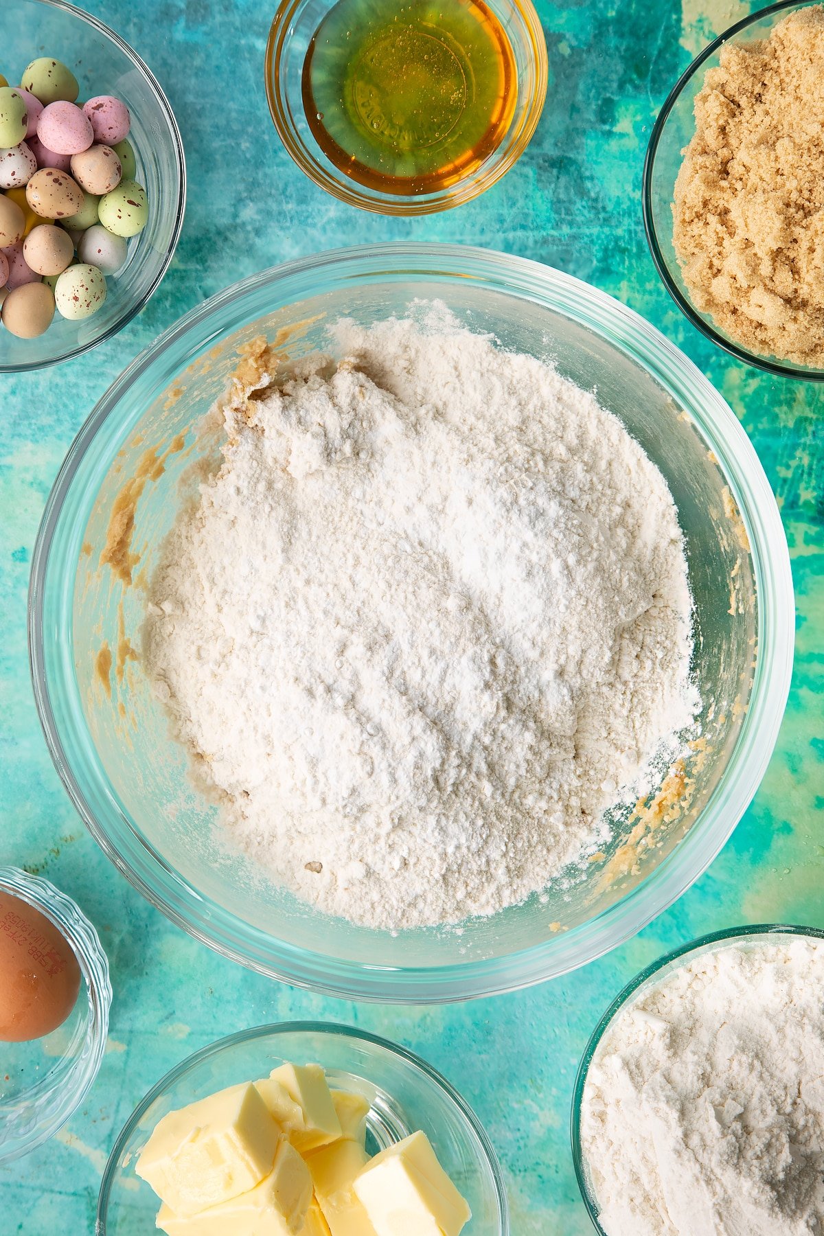 Sifting flour and baking powder into the mixing bowl.