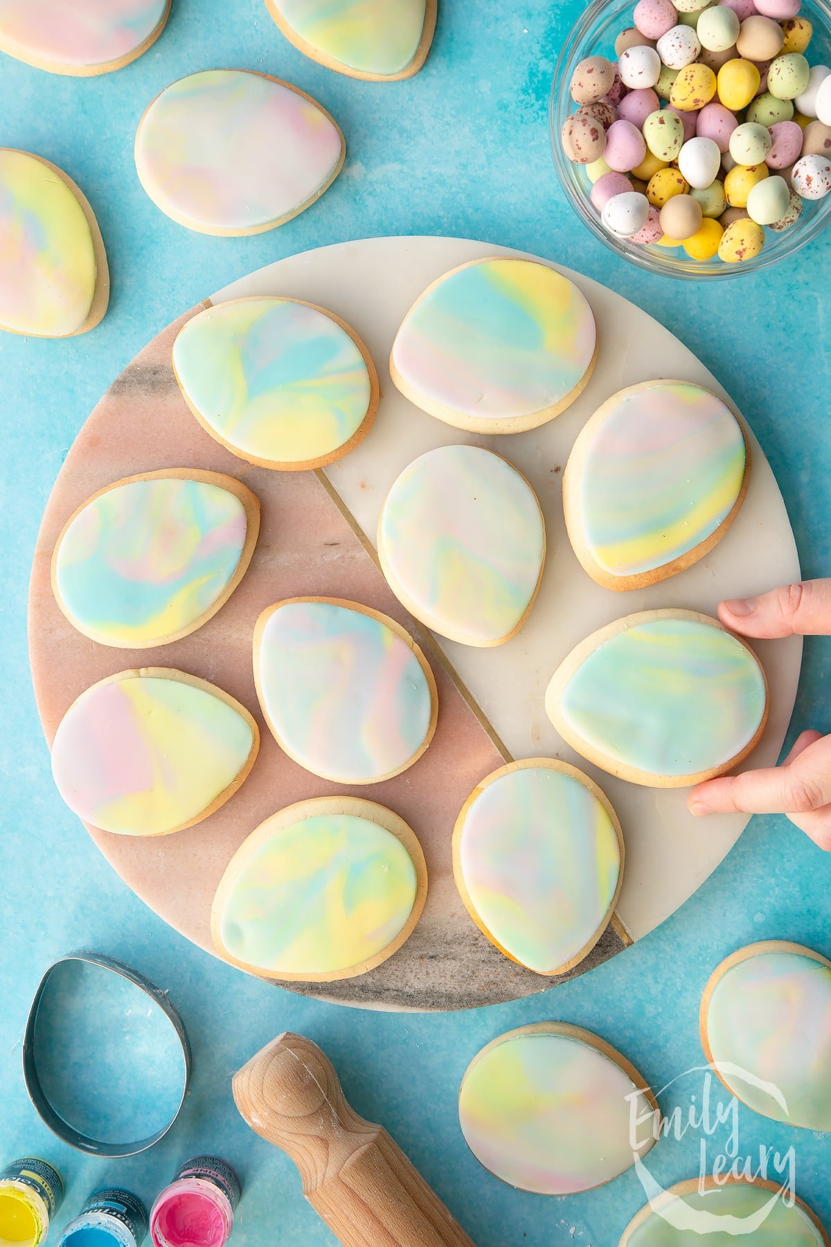Finished serving of Easter sugar cookies on a decorative board.