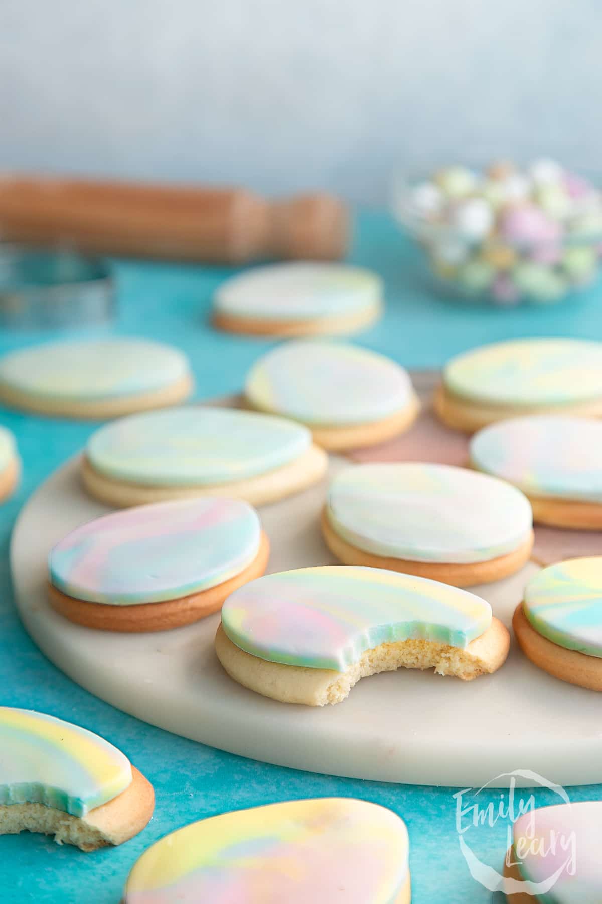 Side on shot of the finished Easter sugar cookies with two cookies having a bite taken out.