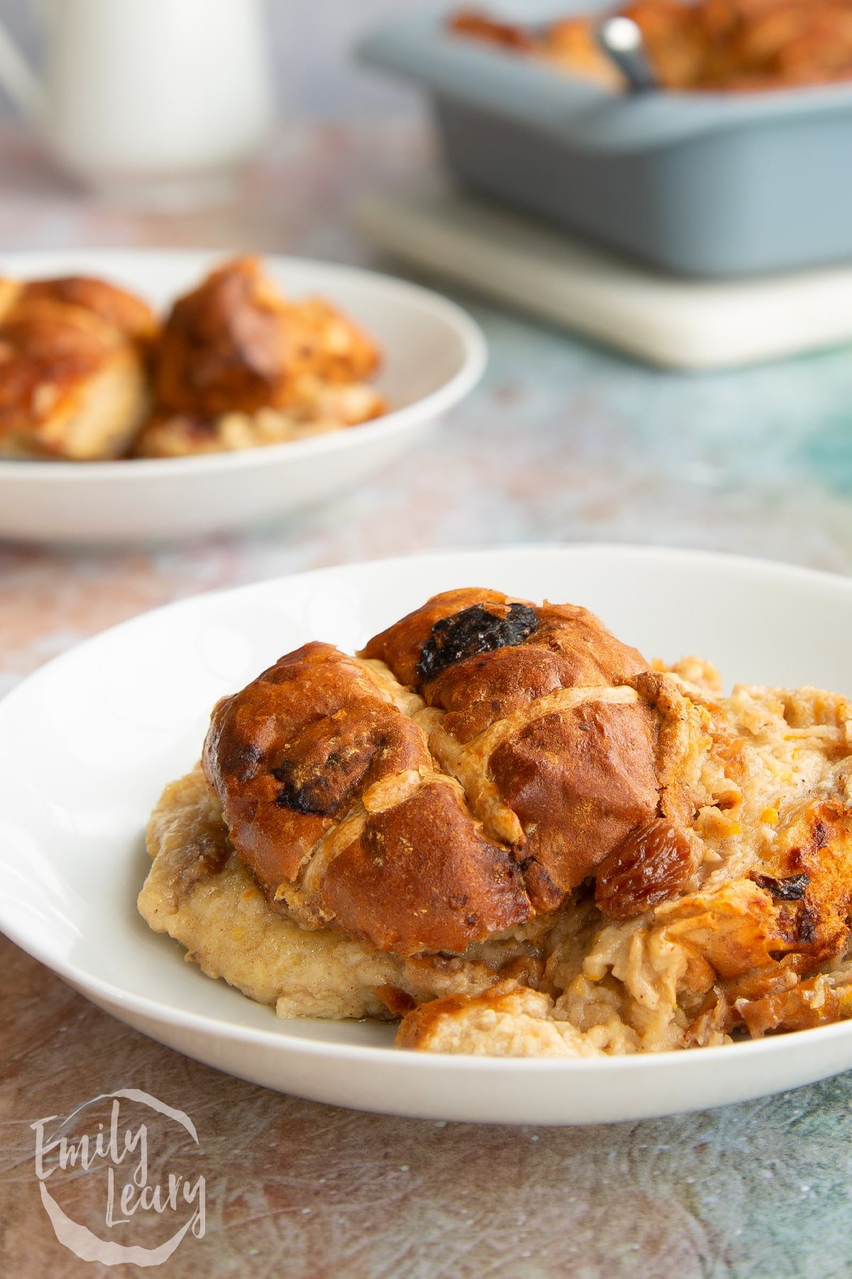 Close up shot of a bowl of hot cross bun bread and butter pudding.