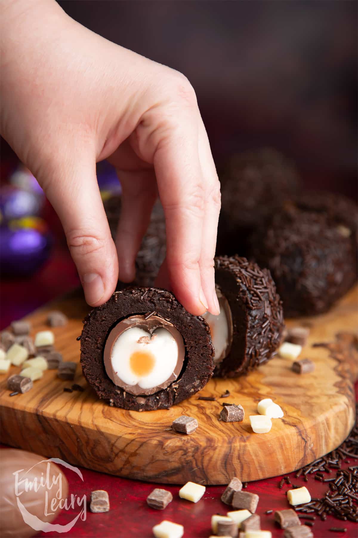 Side on shot of a finished creme Egg Scotch egg cut open.