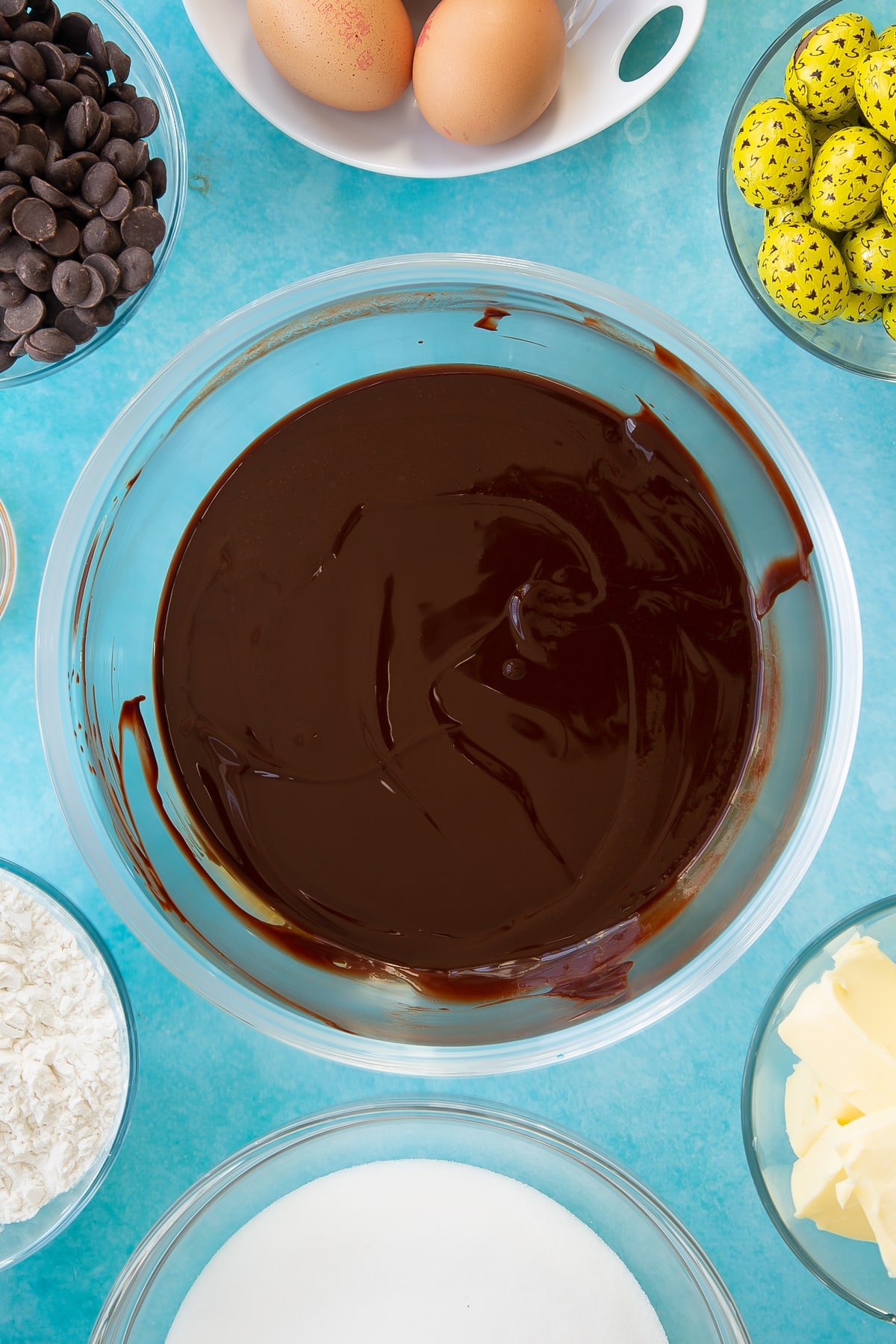 Overhead shot of butter and chocolate chips having been mixed together.