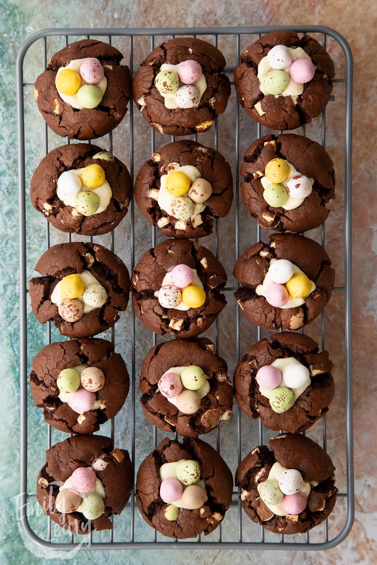 Overhead shot of the finished Easter cheesecake cookies cooling on a wire rack.