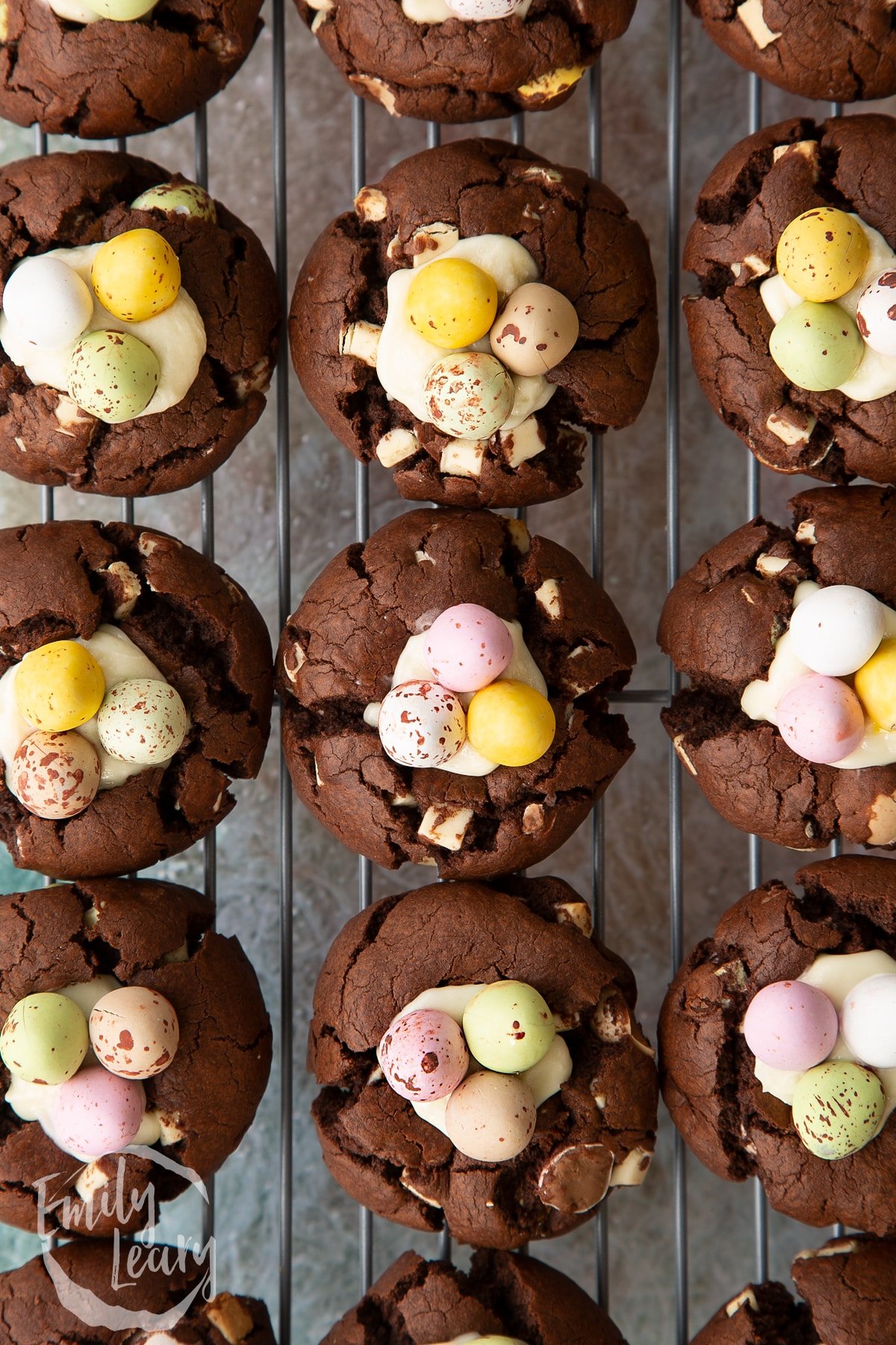 An overhead shot of the finished Easter cheesecake cookies cooling on a wire cooling rack.