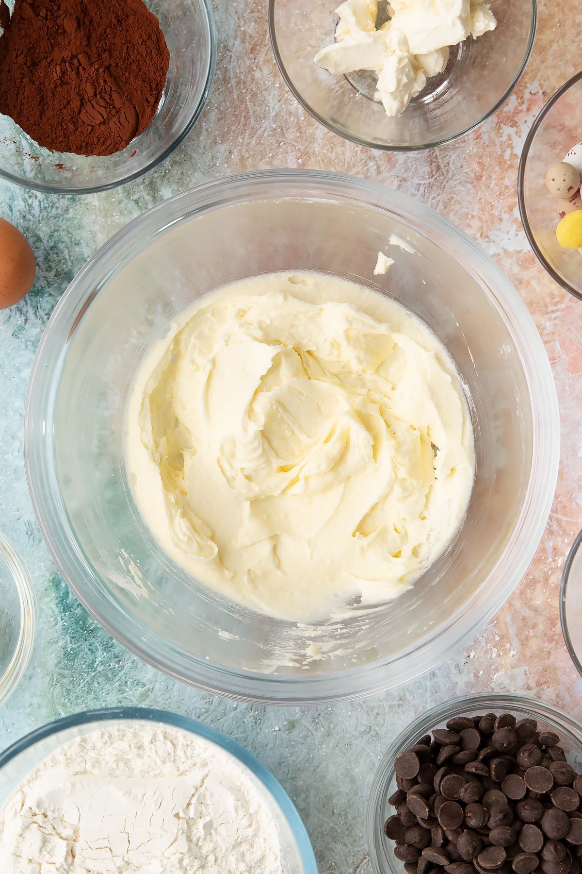 Overhead shot of the Easter cheesecake cookies wet ingredients having been mixed together in a mixing bowl.