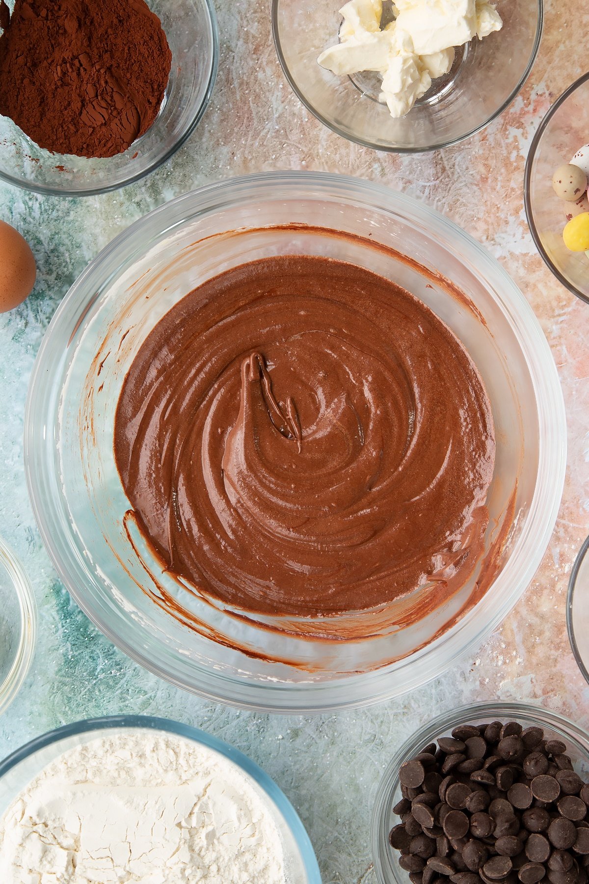 Overhead shot of the wet ingredients for the Easter cheesecake cookies having been whisked together.