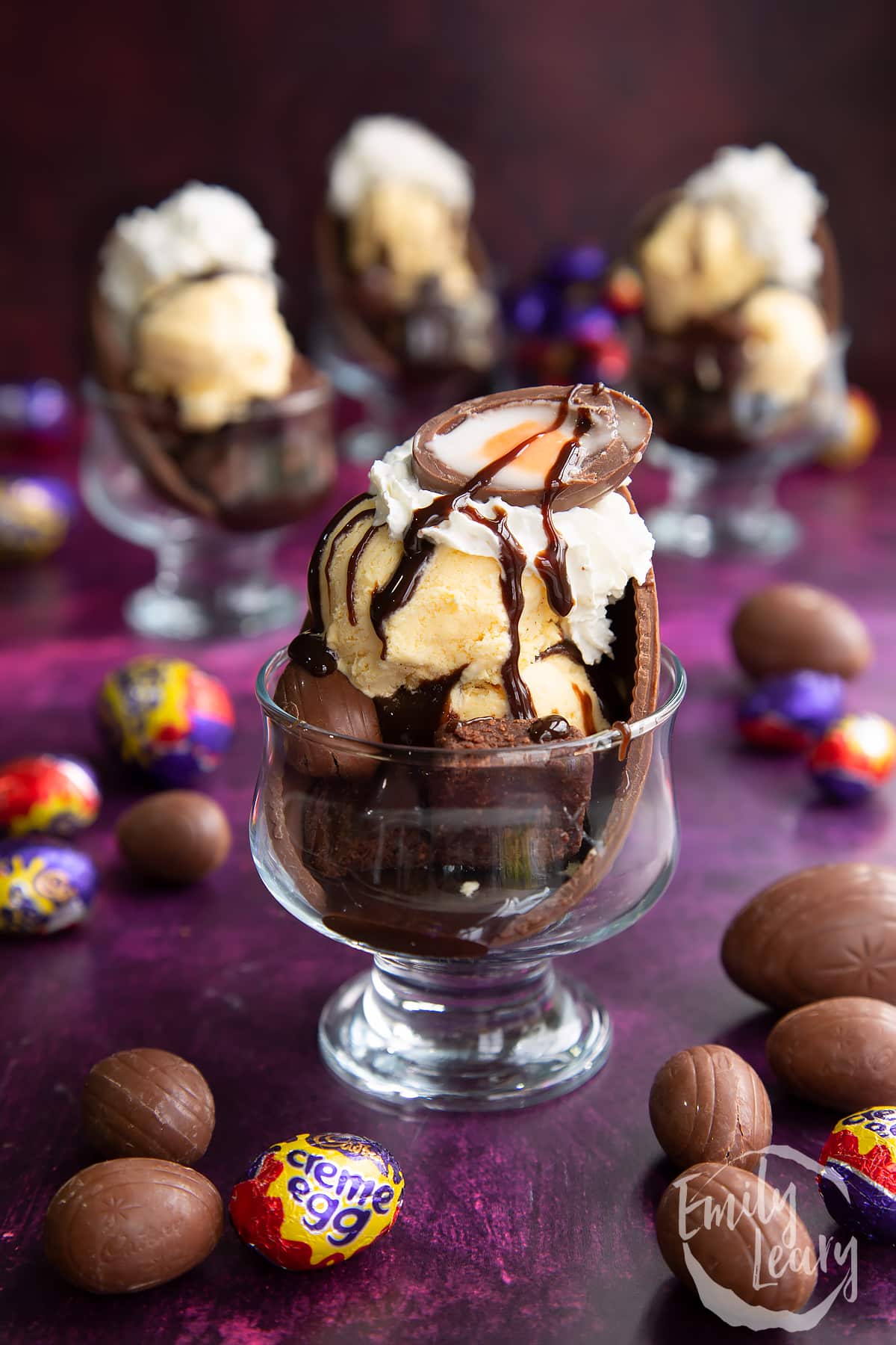 Drizzled chocolate being added to the top of the Easter egg sundae
