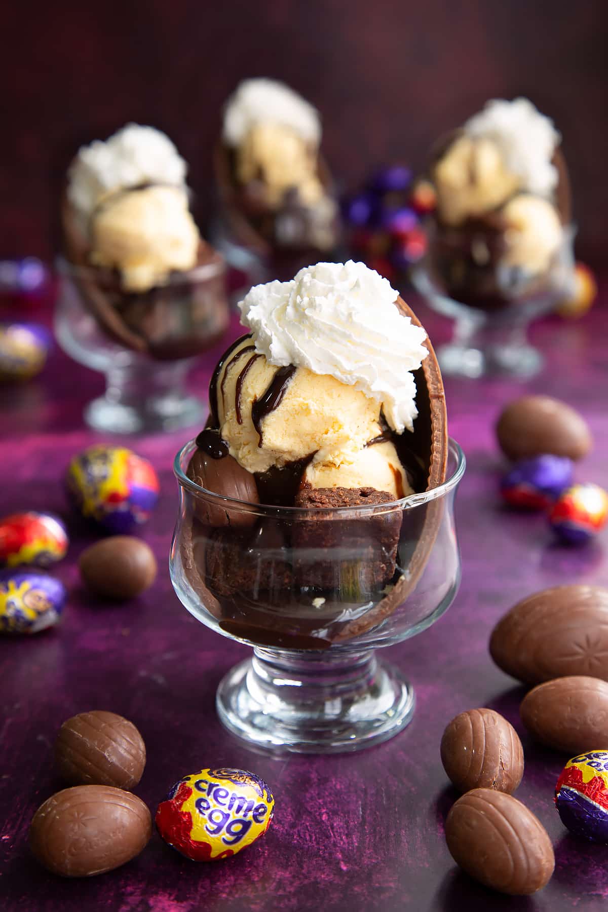 Whipped cream being added to the top of the Easter egg sundae.