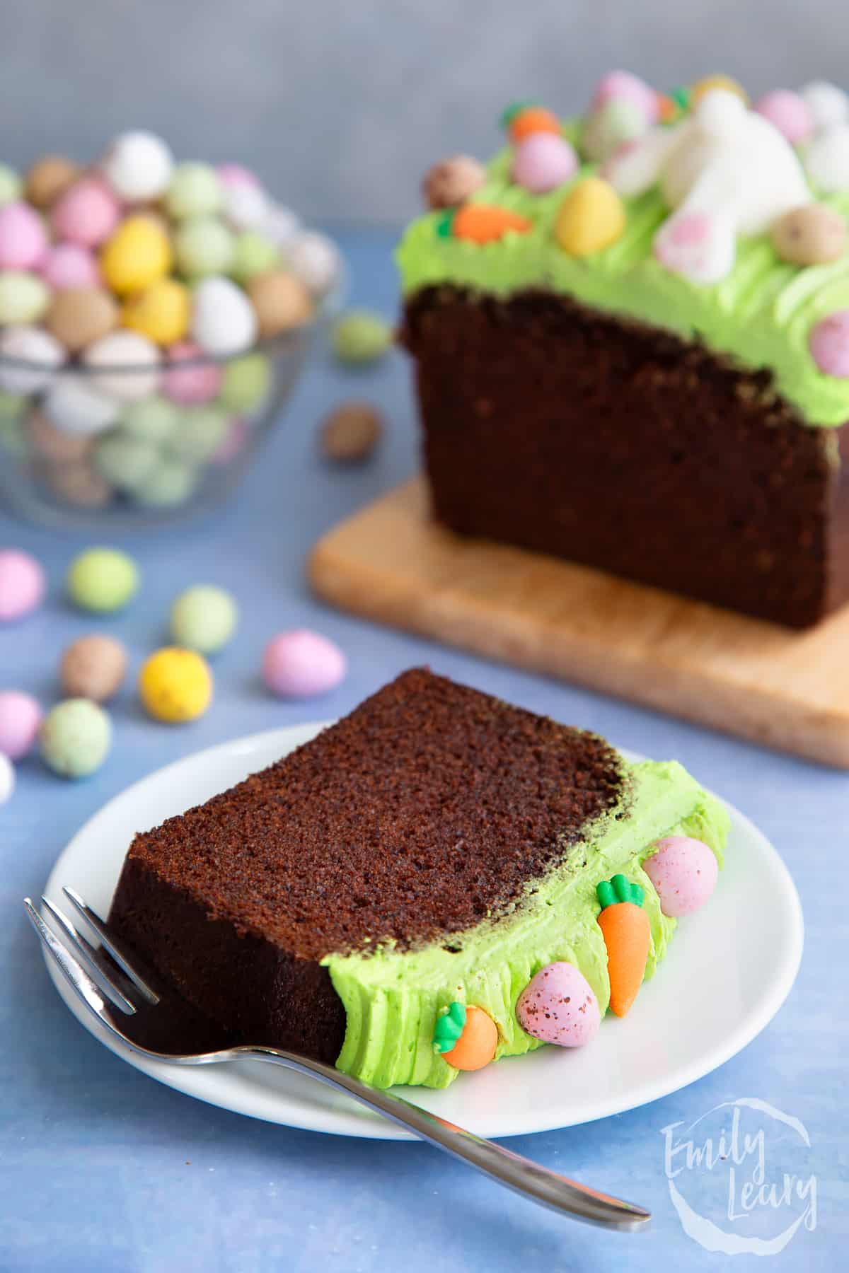 Finished slice of Easter loaf cake on a white plate. 