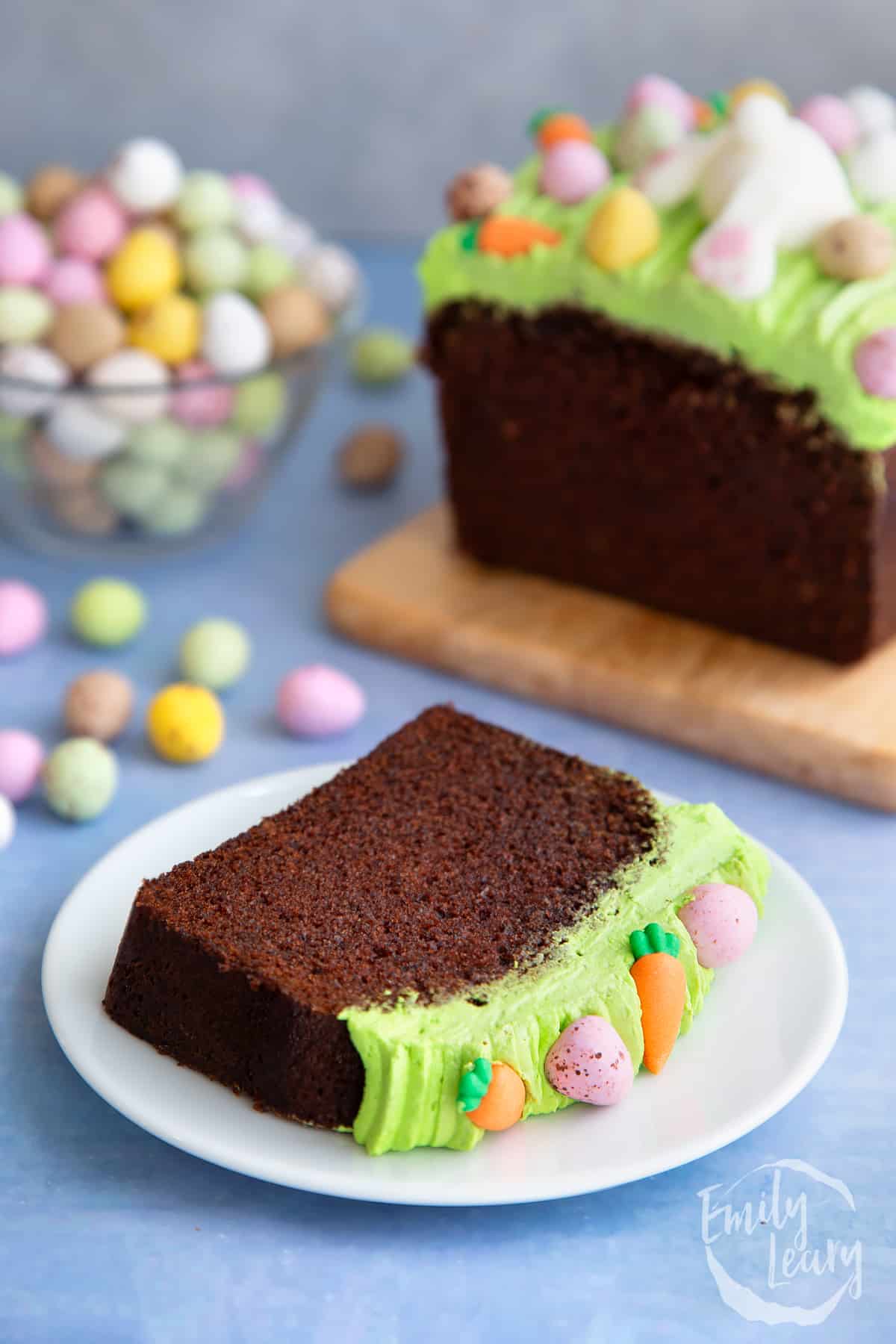Slice of Easter loaf cake on a white plate.