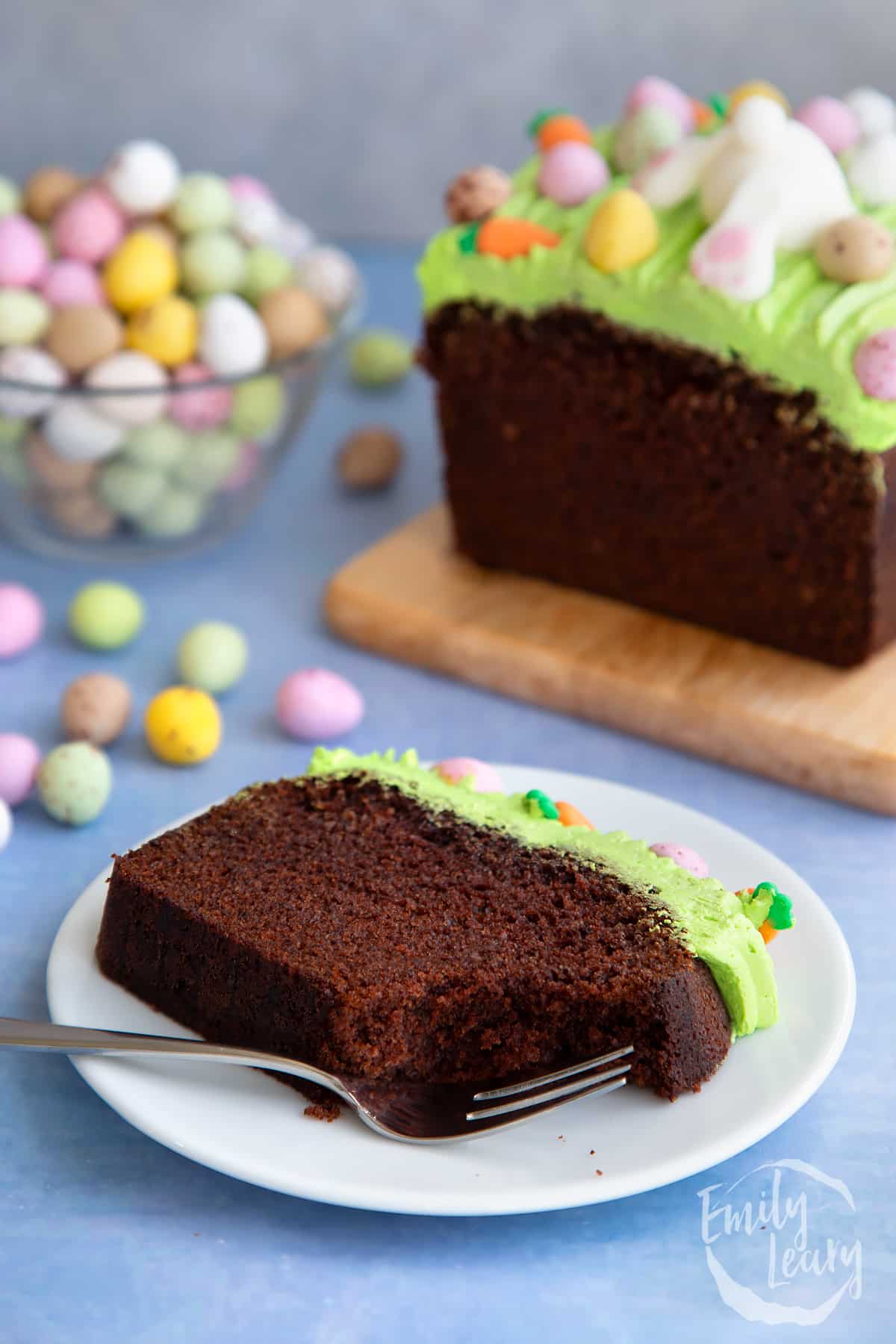 Slice of finished Easter loaf cake served on a white plate. 