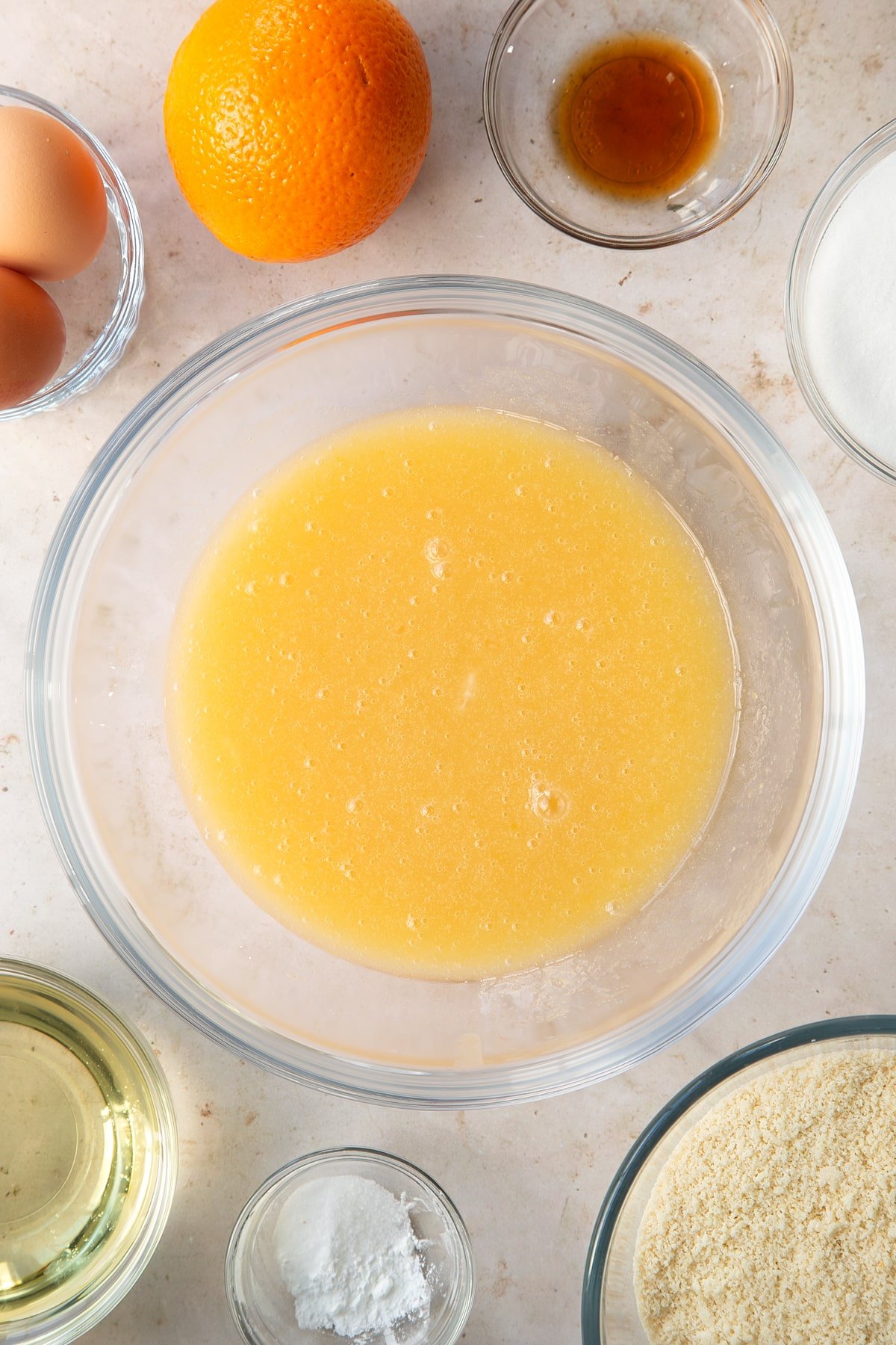 Oil, caster sugar, eggs and vanilla in a large bowl having been whisked together.