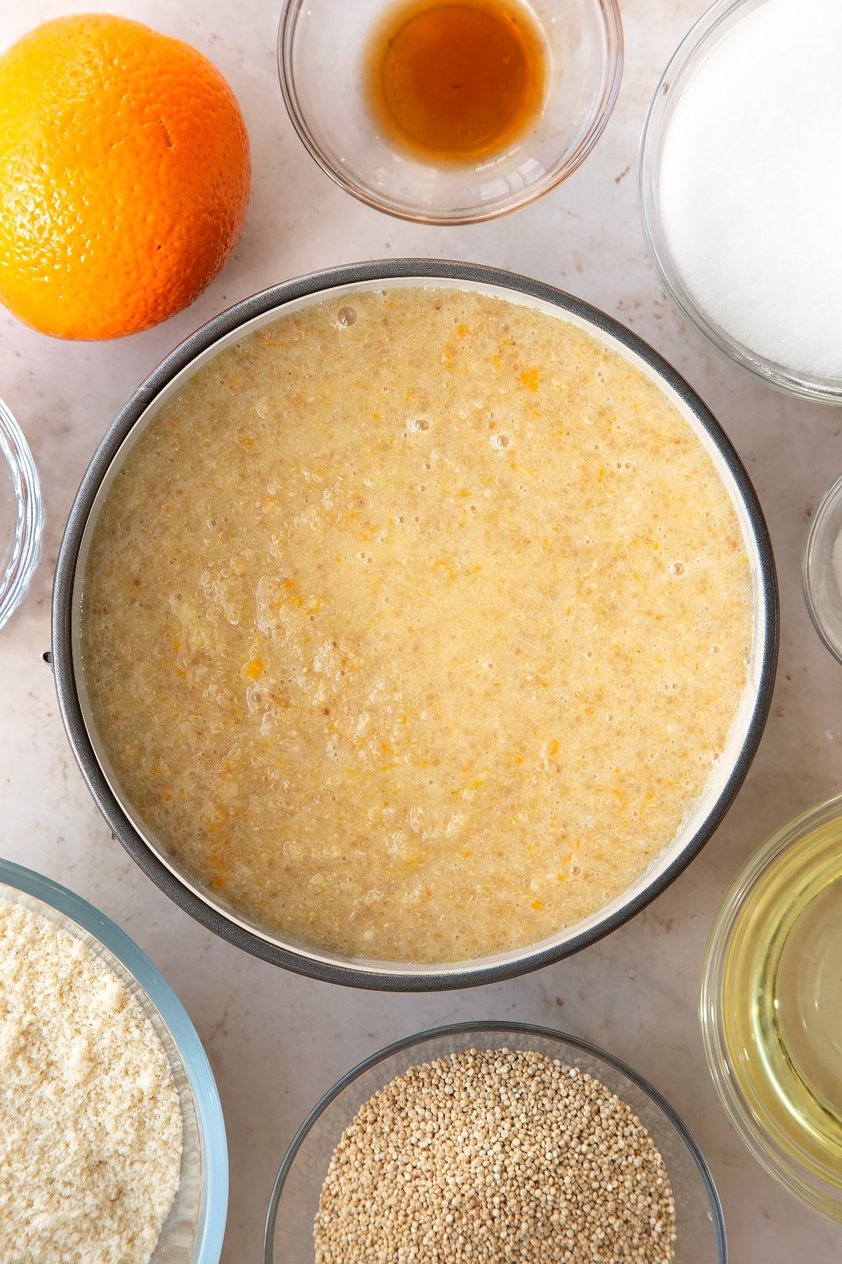 Pouring the cake batter into the cake tin. 