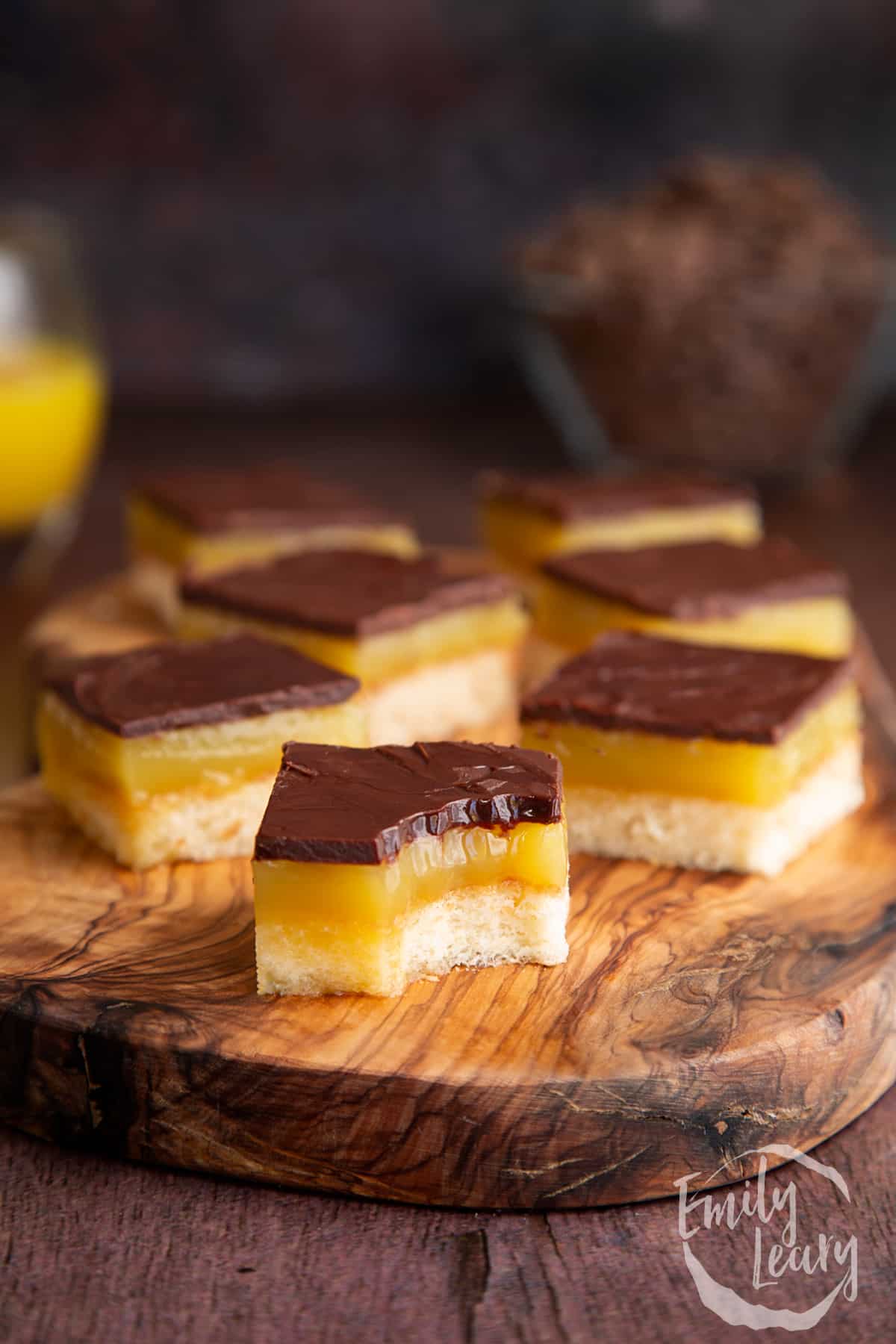 Jaffa Cake traybake slices on a wooden board.