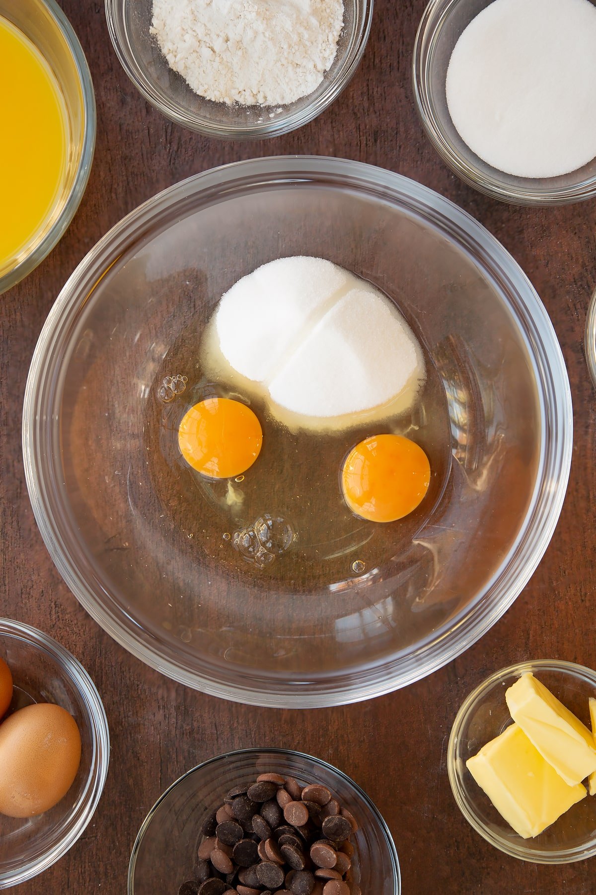 Putting eggs and caster sugar in a mixing bowl.