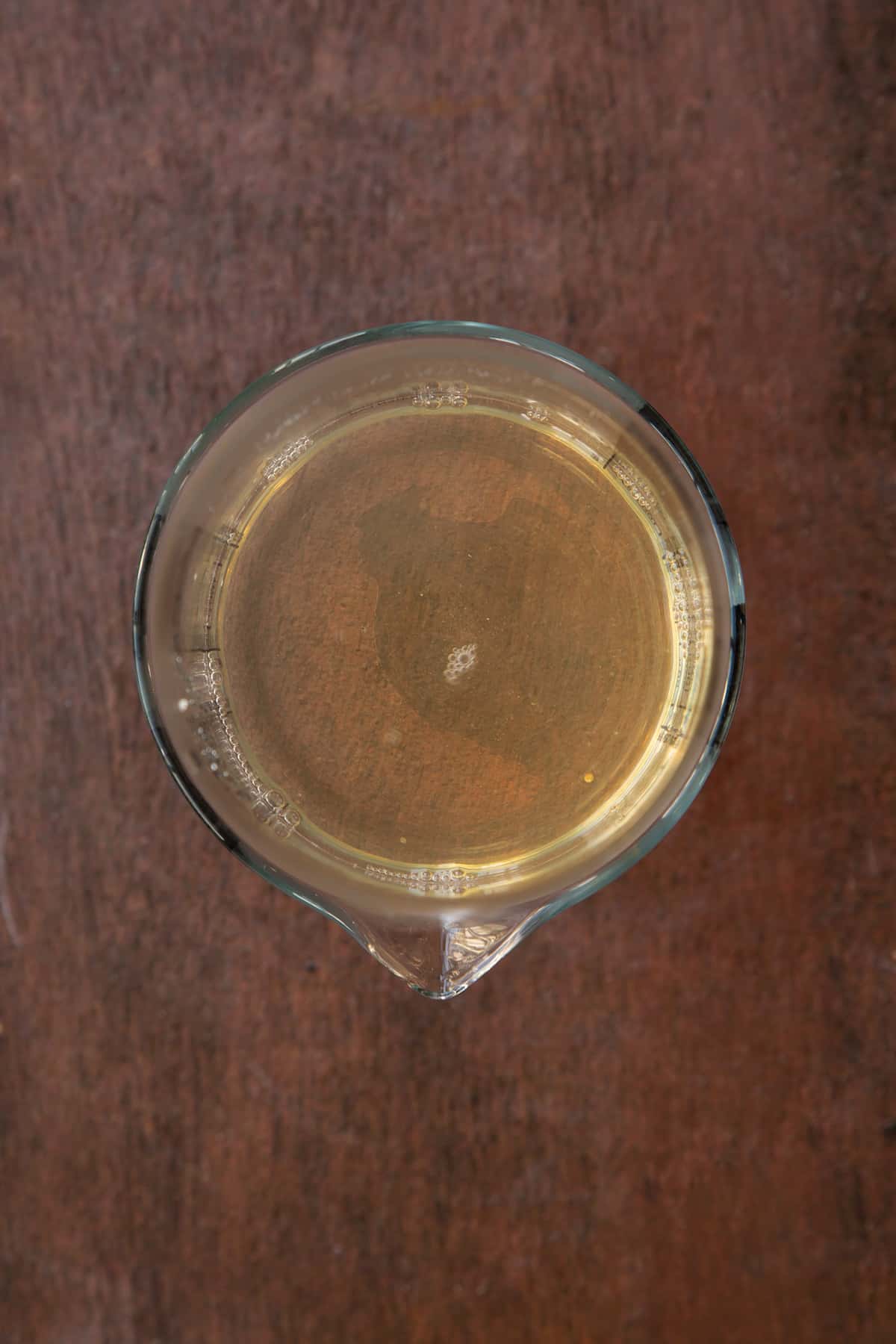 Overhead shot of the jug having been stired until the geletine dissolves.