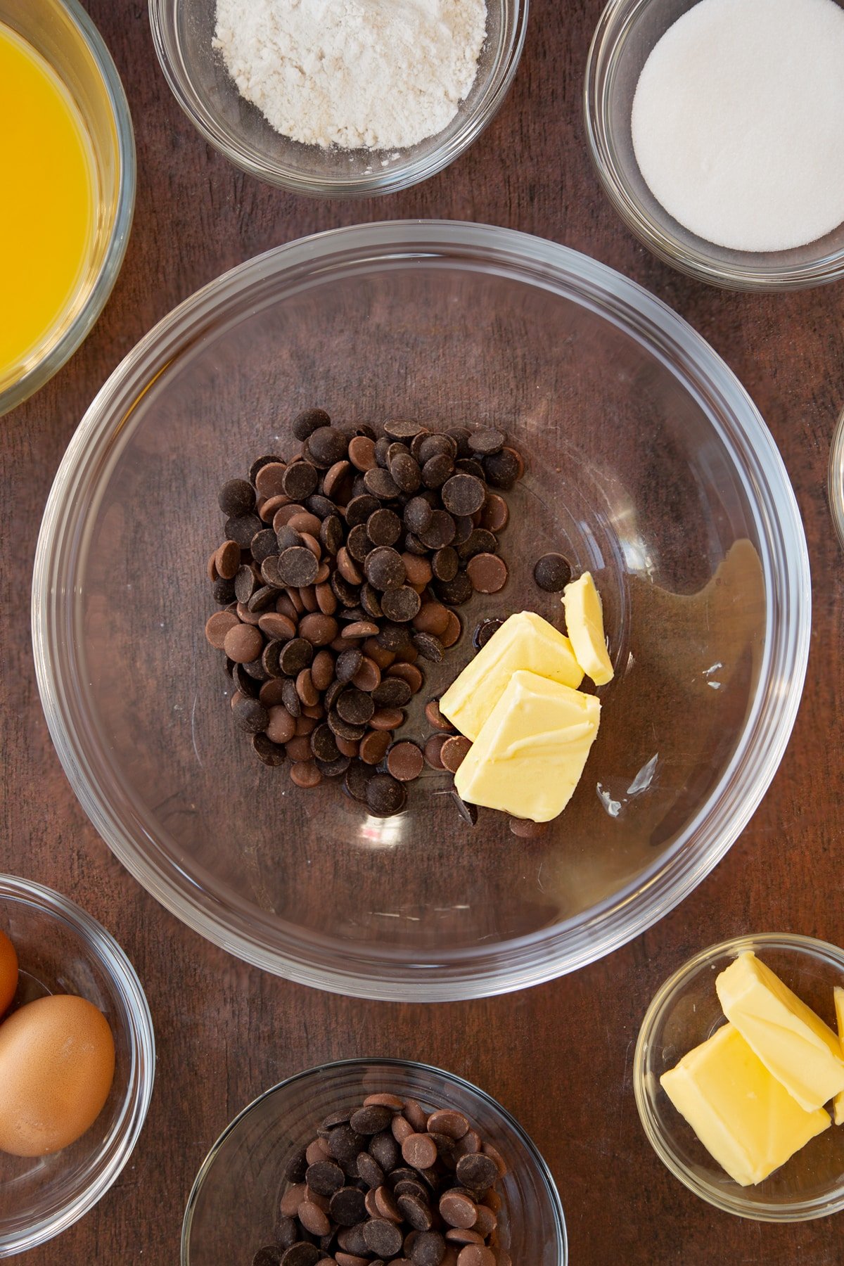 Dark chocolate, milk chocolates, butter and 2 tbsp water in a bowl. 