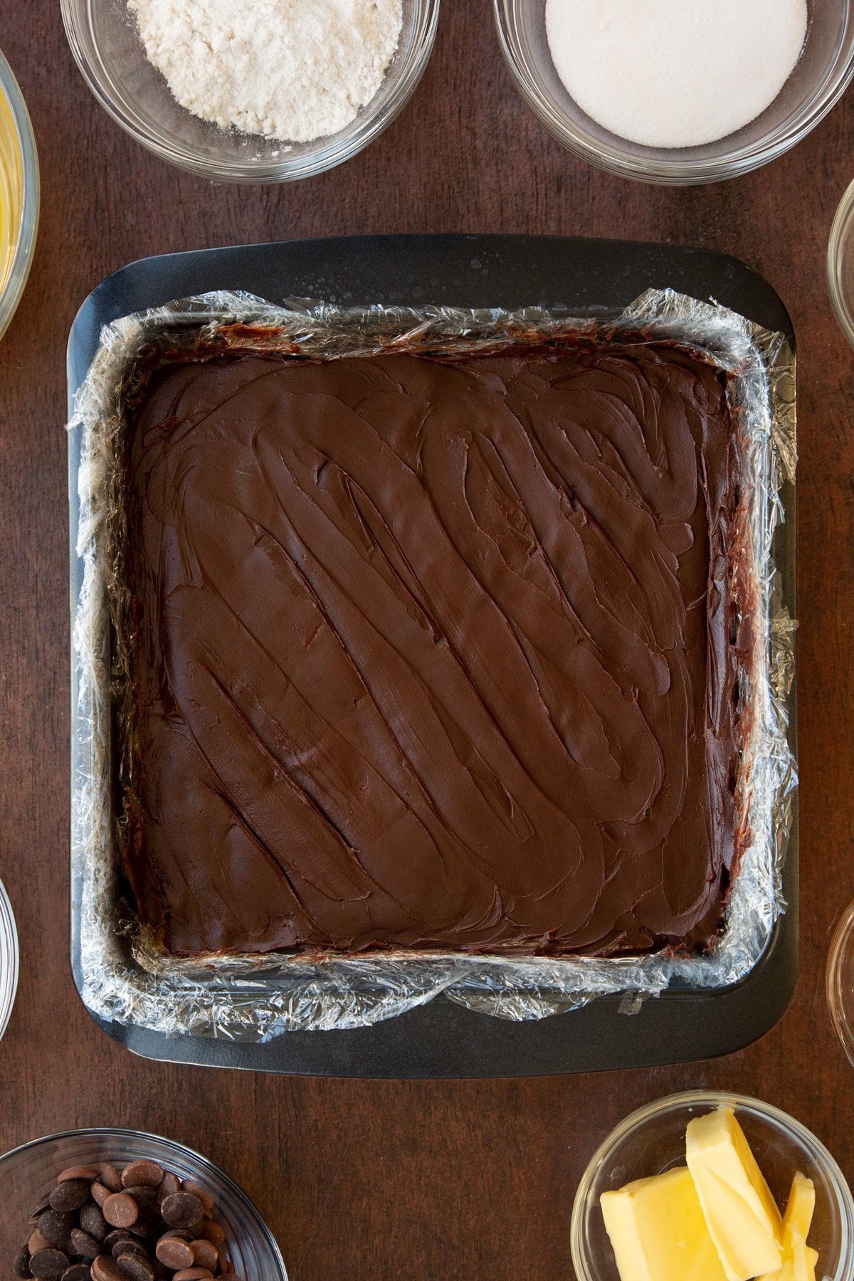 Overhead shot of the baking tray having had chocolate smoothed out ontop. 