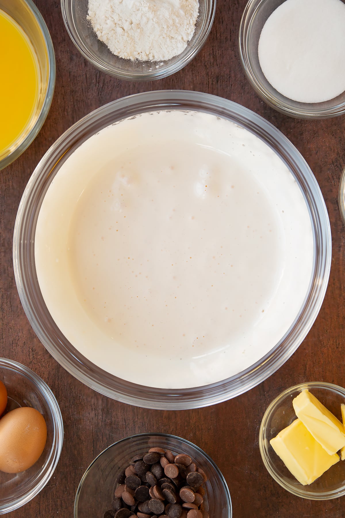 Eggs and caster sugar whisked together in a mixing bowl.