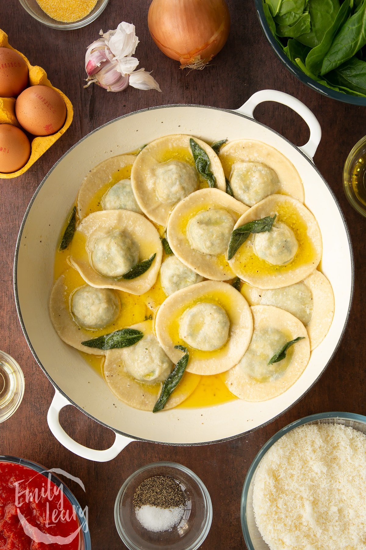 Adding the ravioli to the sage and butter mixture.