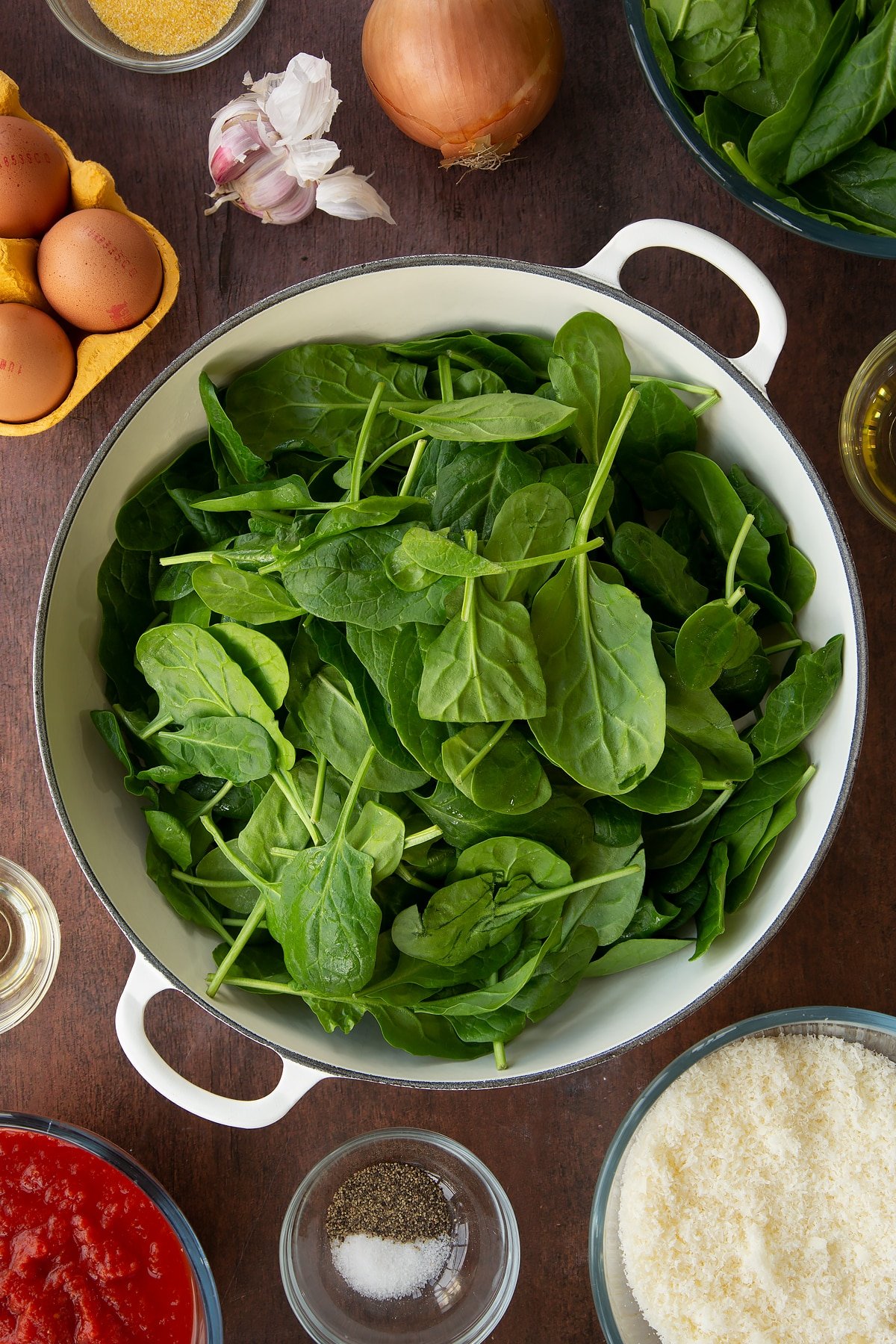 Overhead shot of spinach leaves in a pan.