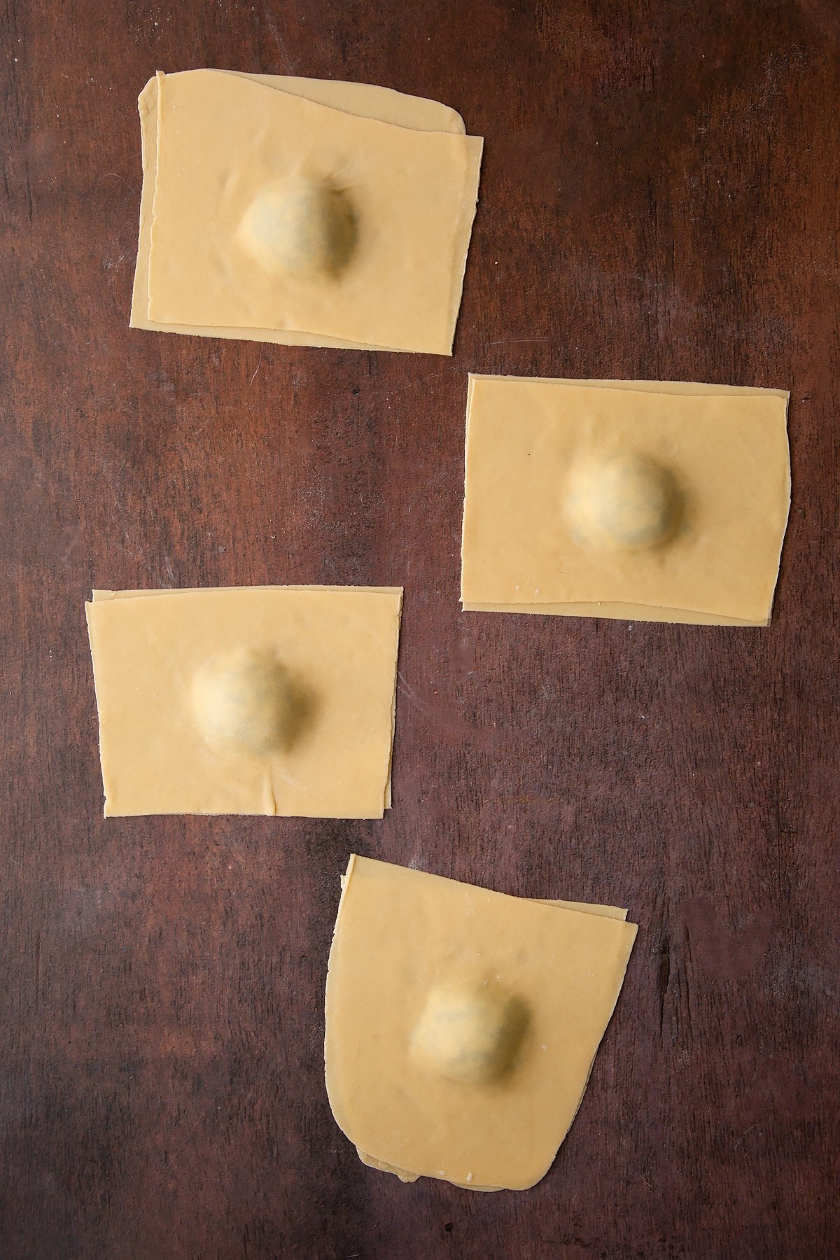 Overhead shot of the ricotta and spinach ravioli having been sealed together. 