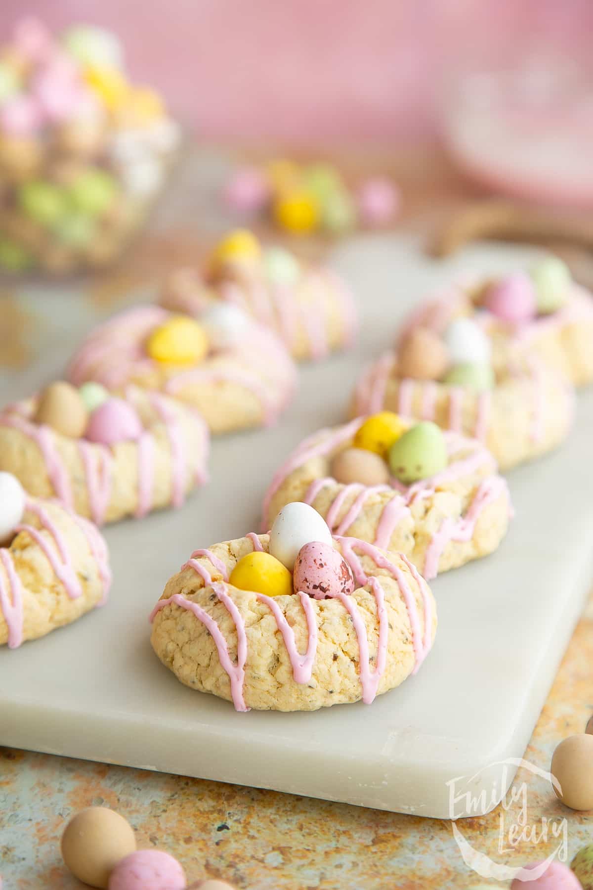 Close up shot of the finished gluten free easter biscuits on a marble board.