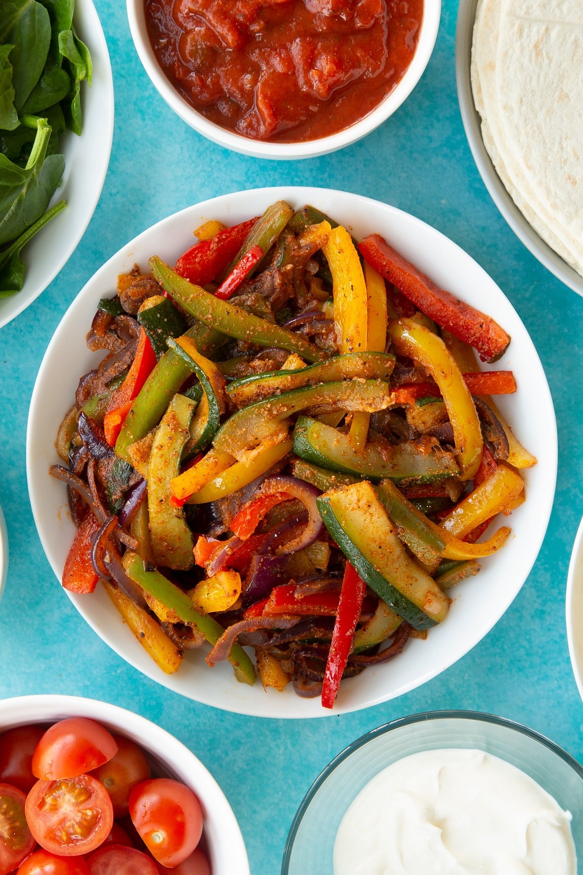 Overhead shot of the veggie fajita mixture in a white bowl.